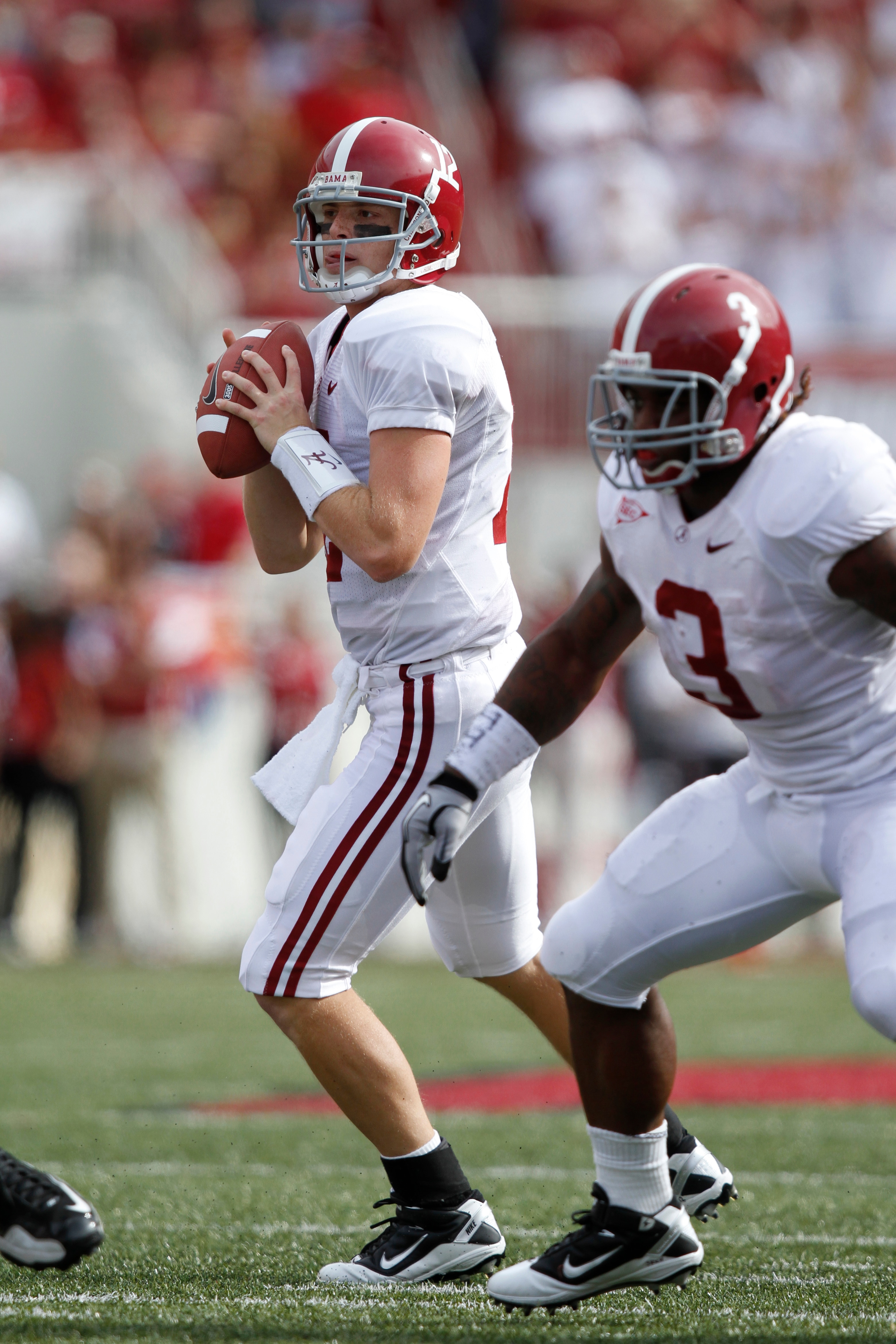 FAYETTEVILLE - SEPTEMBER 25: Greg McElroy #12 of the Alabama Crimson Tide looks to pass against the Arkansas Razorbacks at Donald W. Reynolds Razorback Stadium on September 25, 2010 in Fayetteville, Arkansas. Alabama won 24-20. (Photo by Joe Robbins/Getty