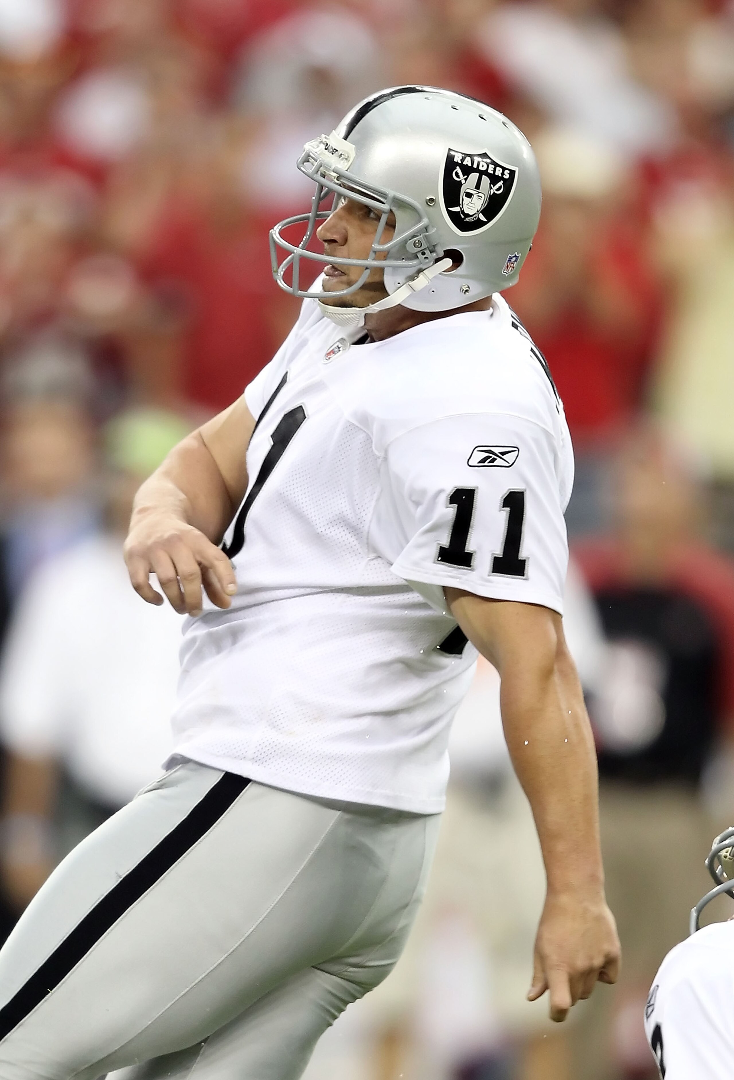 GLENDALE, AZ - SEPTEMBER 26:  Kicker Sebastian Janikowski #11 of the Oakland Raiders watches his missed 32 yard field goal against the Arizona Cardinals during the NFL game at the University of Phoenix Stadium on September 26, 2010 in Glendale, Arizona. T