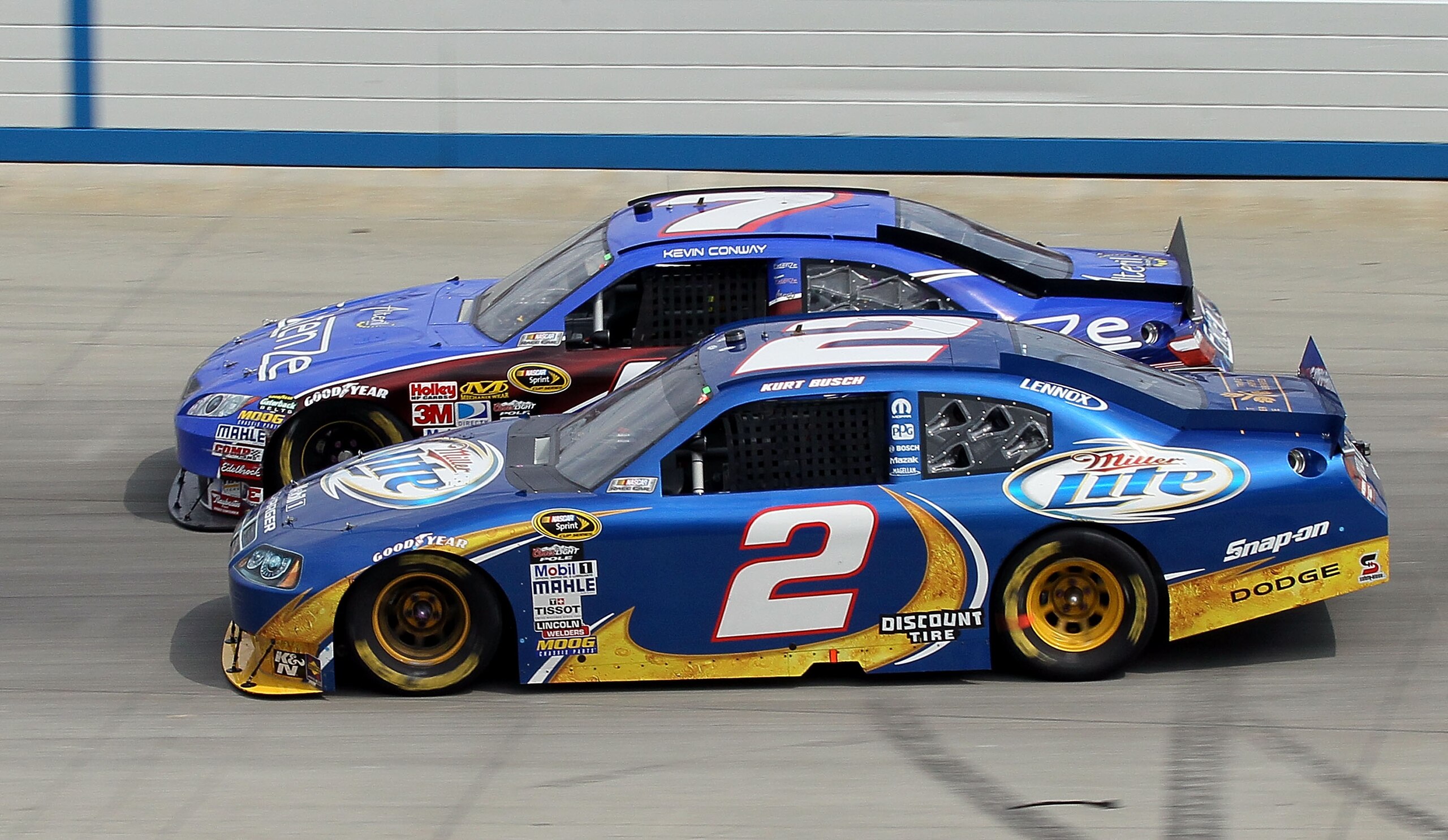 DOVER, DE - SEPTEMBER 26:  Kurt Busch, driver of the #2 Miller Lite/Vortex Dodge, races Kevin Conway, driver of the #7 Extenze Toyota, during the NASCAR Sprint Cup Series AAA 400 at Dover International Speedway on September 26, 2010 in Dover, Delaware.  (