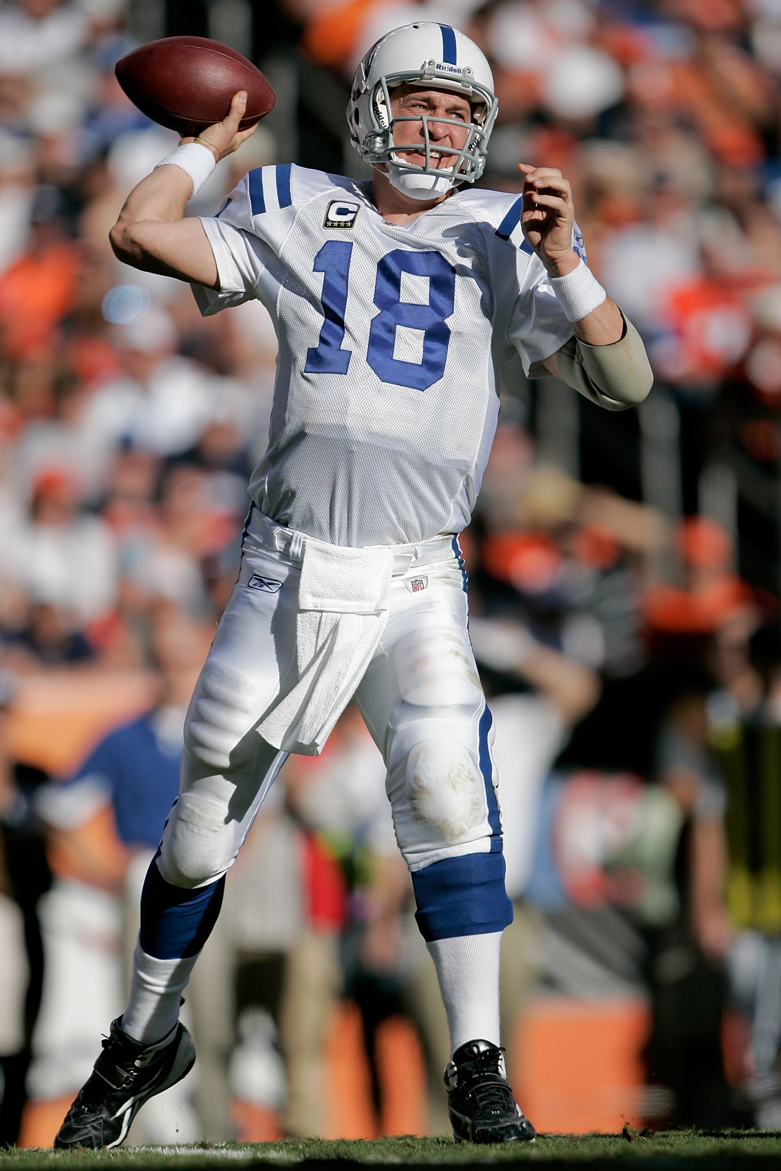 DENVER - SEPTEMBER 26:  Quarterback Peyton Manning #18 of the Indianapolis Colts makes a pass against the Denver Broncos during NFL action at INVESCO Field at Mile High on September 26, 2010 in Denver, Colorado. The Colts won 27-13. (Photo by Justin Edmon