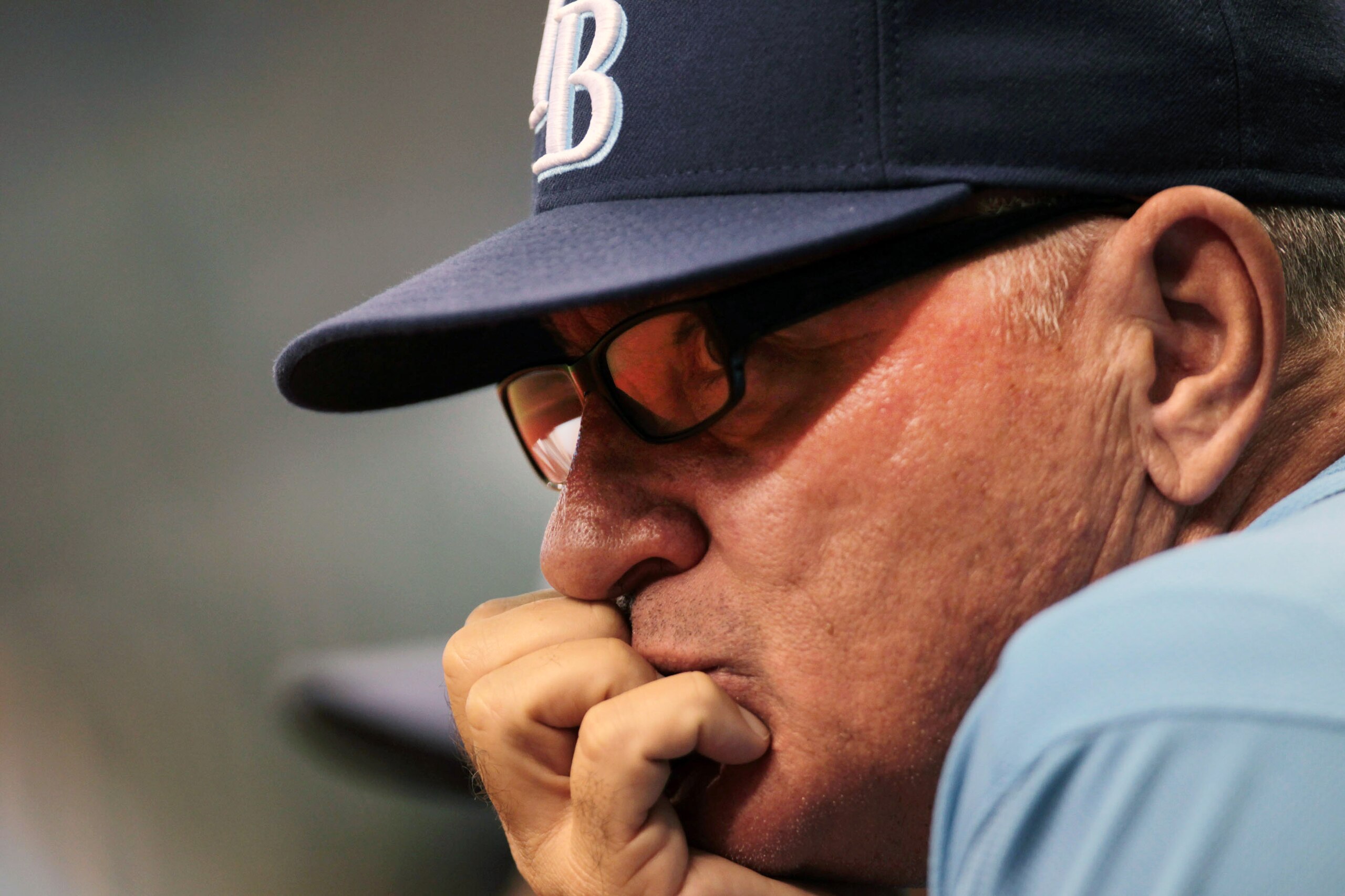 ST PETERSBURG, FL - SEPTEMBER 26: Manager Joe Maddon #70 of the Tampa Bay Rays watches the action from the dugout against the Seattle Mariners at Tropicana Field on September 26, 2010 in St. Petersburg, Florida. (Photo by Eliot J. Schechter/Getty Images)