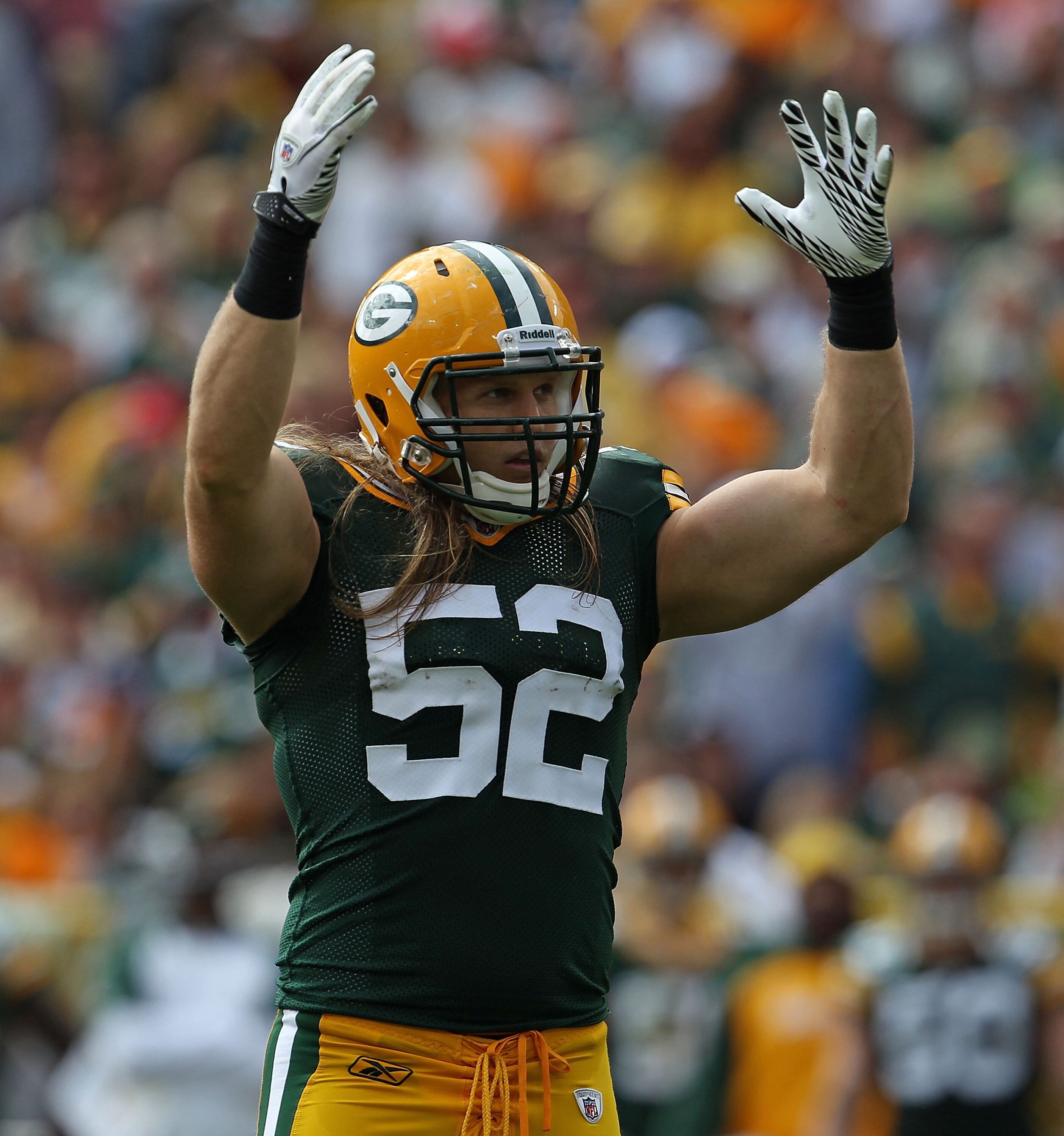 GREEN BAY, WI - SEPTEMBER 19: Clay Matthews #52 of the Green Bay Packers encourages the crowd to cheer during a game against the Buffalo Bills at Lambeau Field on September 19, 2010 in Green Bay, Wisconsin. The Packers defeated the Bills 34-7.  (Photo by