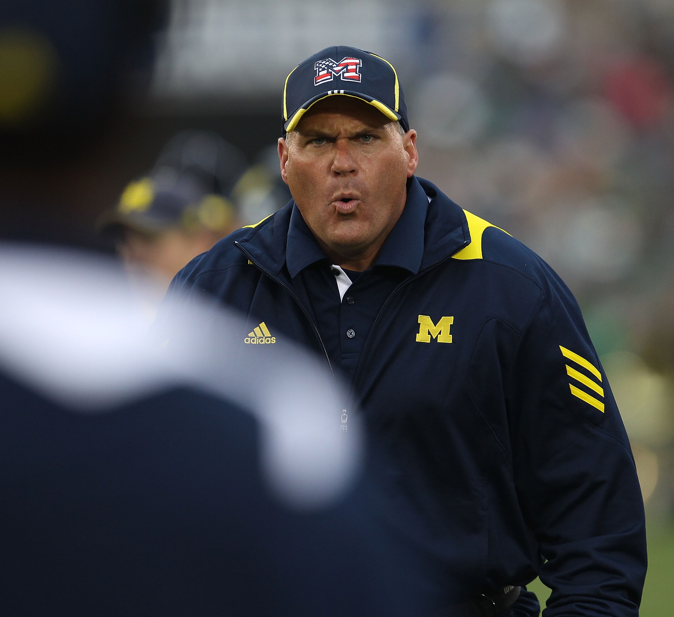 SOUTH BEND, IN - SEPTEMBER 11: Head coach Rich Rodriguez of the Michigan Wolverines yells at an assistant coach during a game against the Notre Dame Fighting Irish at Notre Dame Stadium on September 11, 2010 in South Bend, Indiana. Michigan defeated Notre