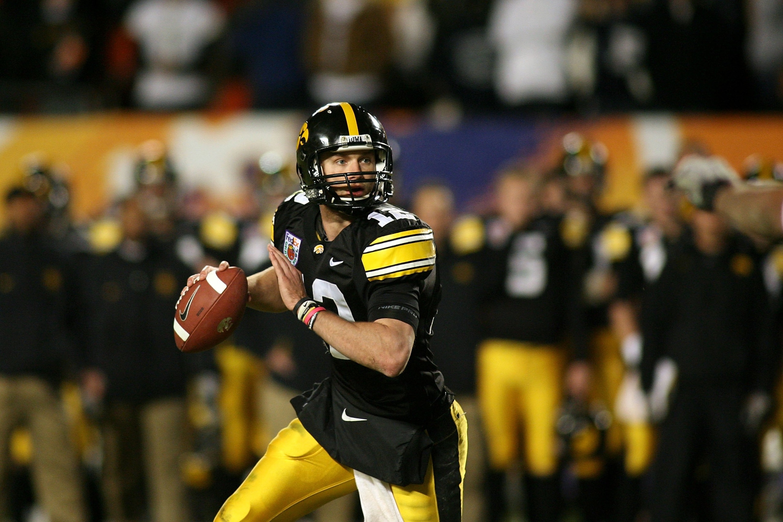 MIAMI GARDENS, FL - JANUARY 05:  Quarterback Richy Stanzi #12 of the Iowa Hawkeyes rolls out of the pocket against the Georgia Tech Yellow Jackets during the FedEx Orange Bowl at Land Shark Stadium on January 5, 2010 in Miami Gardens, Florida. Iowa won 24
