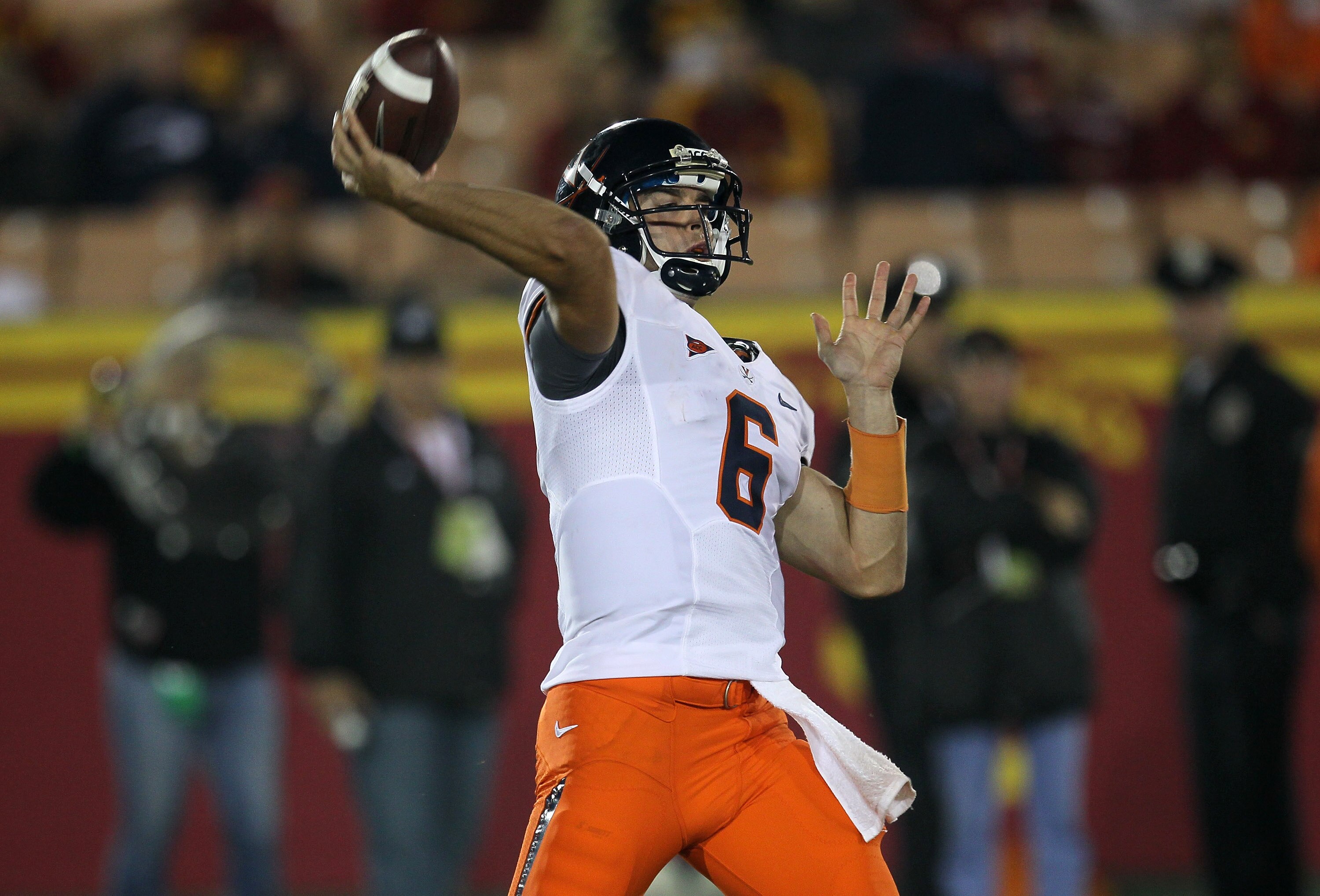 LOS ANGELES, CA - SEPTEMBER 11:  Quarterback Marc Verica #6 of the Virginia Cavaliers throws a pass against the USC Trojans at Los Angeles Memorial Coliseum on September 11, 2010 in Los Angeles, California. USC won 17-14.  (Photo by Stephen Dunn/Getty Ima