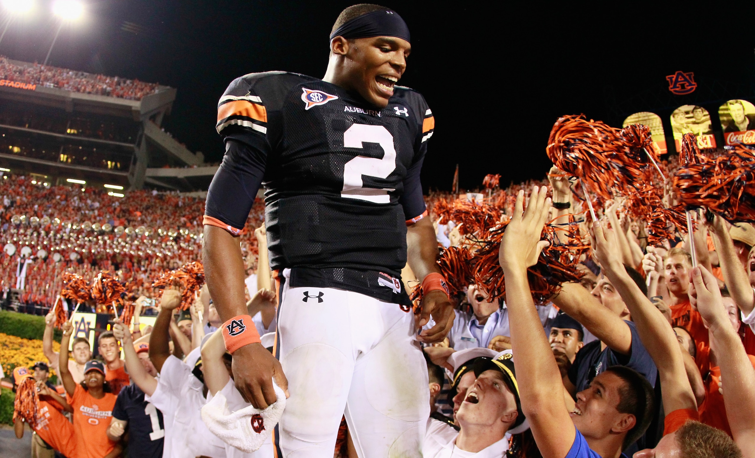 AUBURN, AL - SEPTEMBER 25:  Quarterback Cameron Newton #2 of the Auburn Tigers celebrates in the stands after their 35-27 win over the South Carolina Gamecocks at Jordan-Hare Stadium on September 25, 2010 in Auburn, Alabama.  (Photo by Kevin C. Cox/Getty