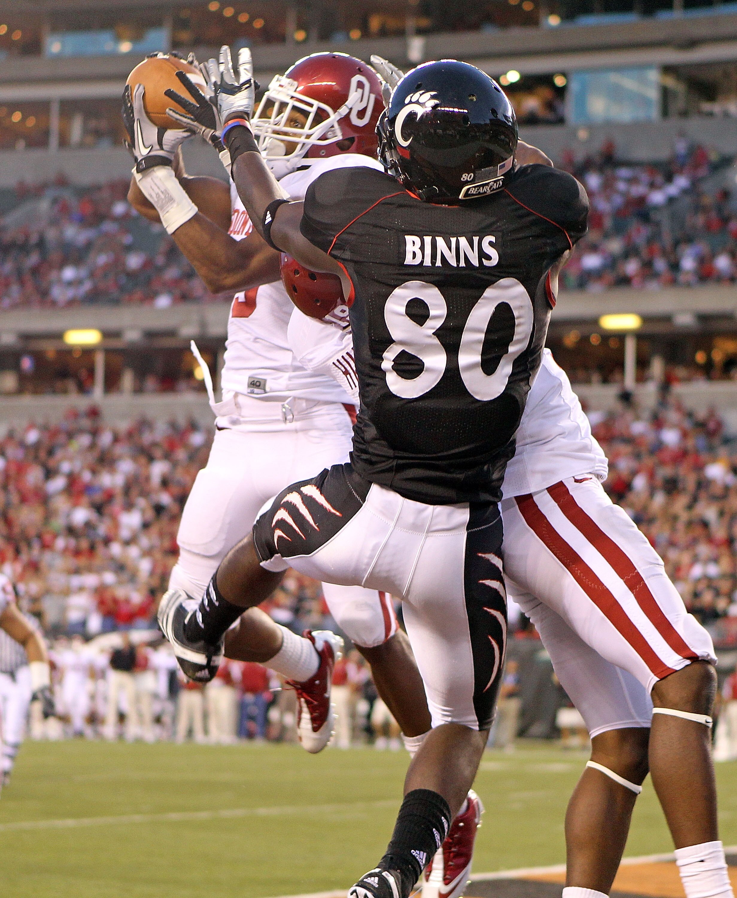 CINCINNATI - SEPTEMBER 25: Jonathan Nelson #3 of the Oklahoma Sooners intercepts a pass intended for Armon Binns #80 of the Cincinnati Bearcats during the game at Paul Brown Stadium on September 25, 2010 in Cincinnati, Ohio.  (Photo by Andy Lyons/Getty Im