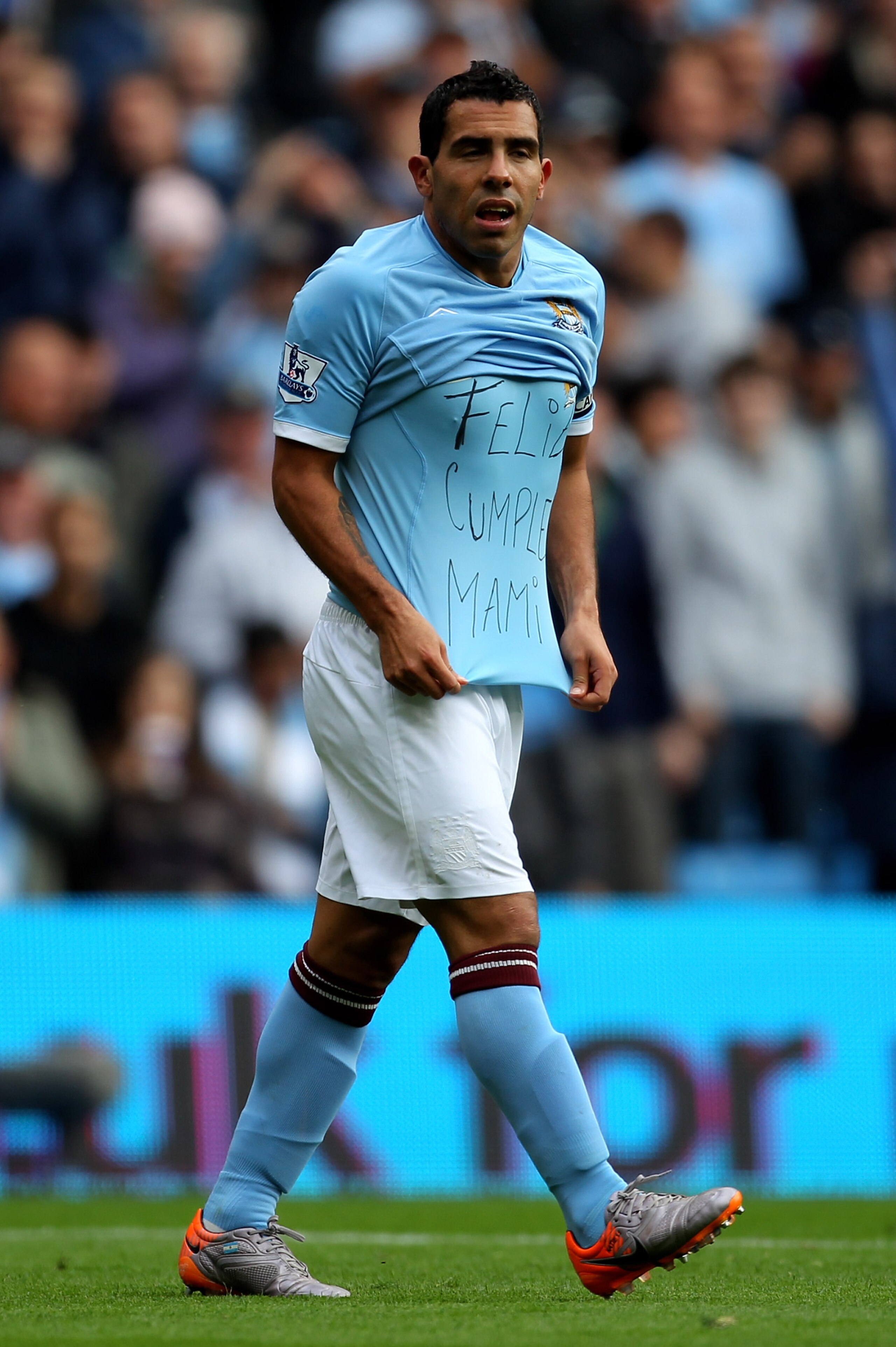 MANCHESTER, ENGLAND - SEPTEMBER 25:  Carlos Tevez of Manchester City shows off a message on his T-Shirt after scoring the opening goal during the Barclays Premier League match between Manchester City and Chelsea at the City of Manchester Stadium on Septem