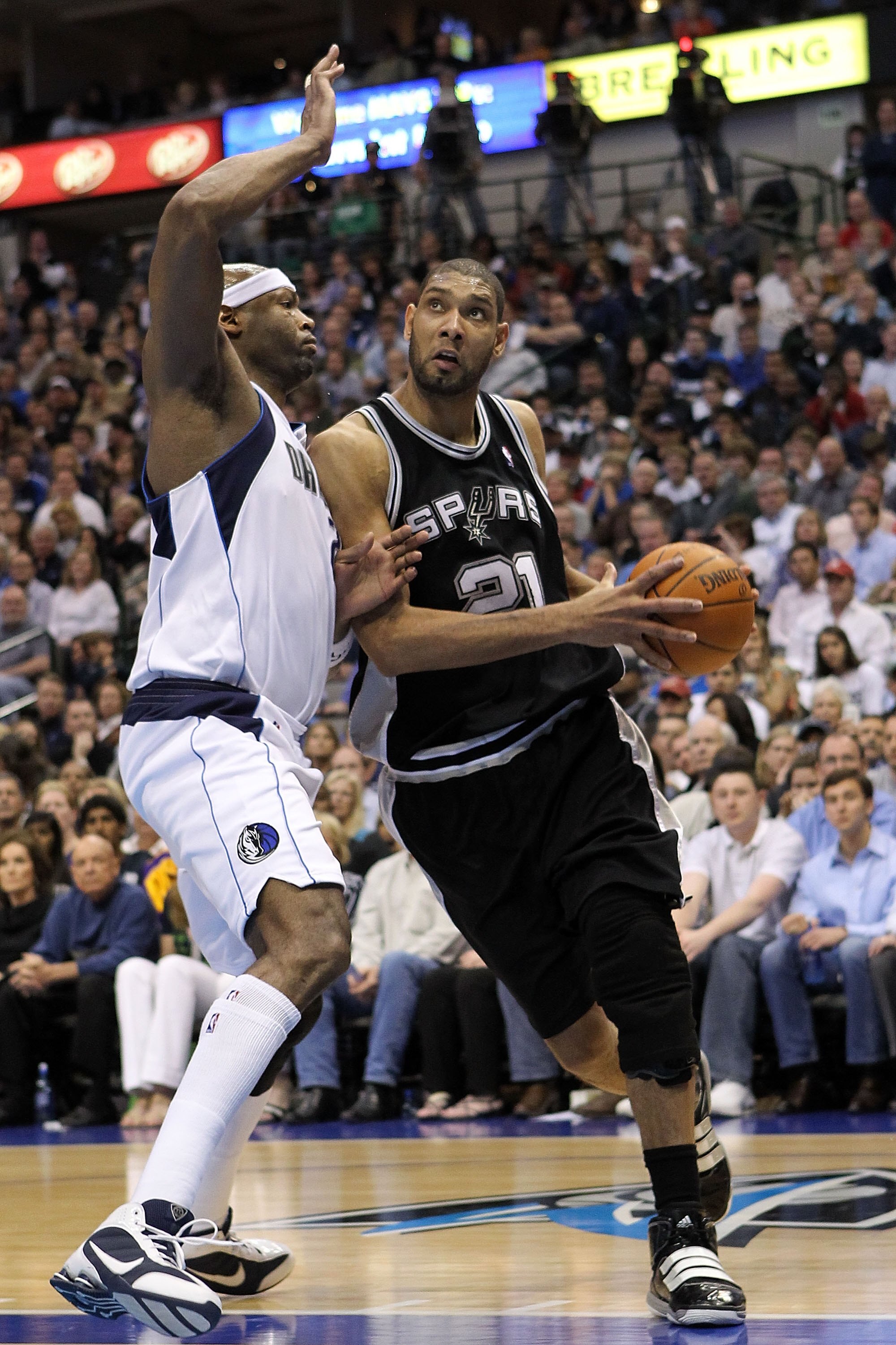 DALLAS - APRIL 18:  Forward Tim Duncan #21 of the San Antonio Spurs dribbles the ball against Erick Dampier #25 of the Dallas Mavericks in Game One of the Western Conference Quarterfinals during the 2010 NBA Playoffs at American Airlines Center on April 1
