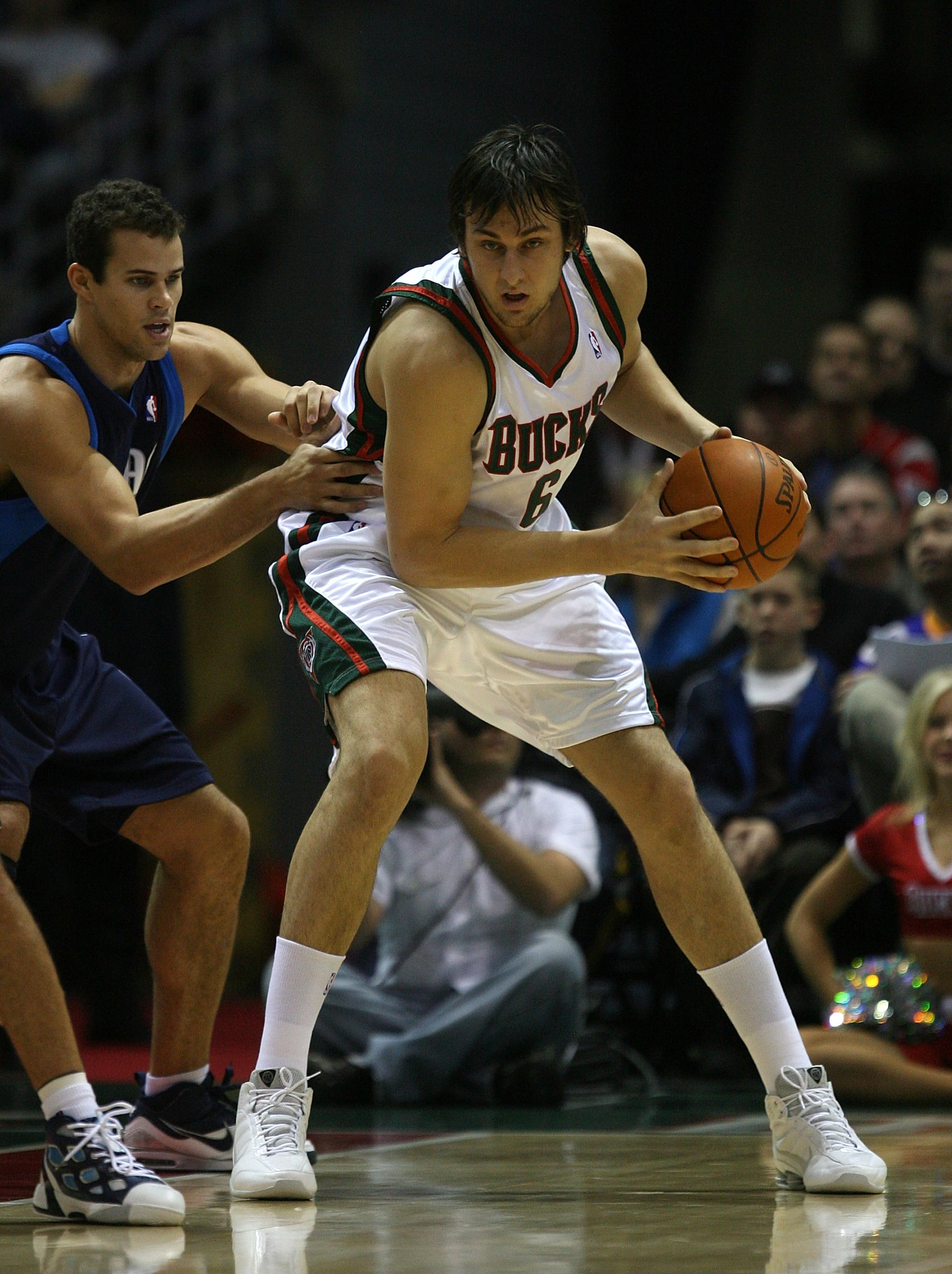MILWAUKEE - NOVEMBER 16: Andrew Bogut #6 of the Milwuakee Bucks moves against Kris Humphries #43 of the Dallas Mavericks at the Bradley Center on November 16, 2009 in Milwaukee, Wisconsin. The Mavericks defeated the Bucks 115-113 in overtime.  (Photo by J