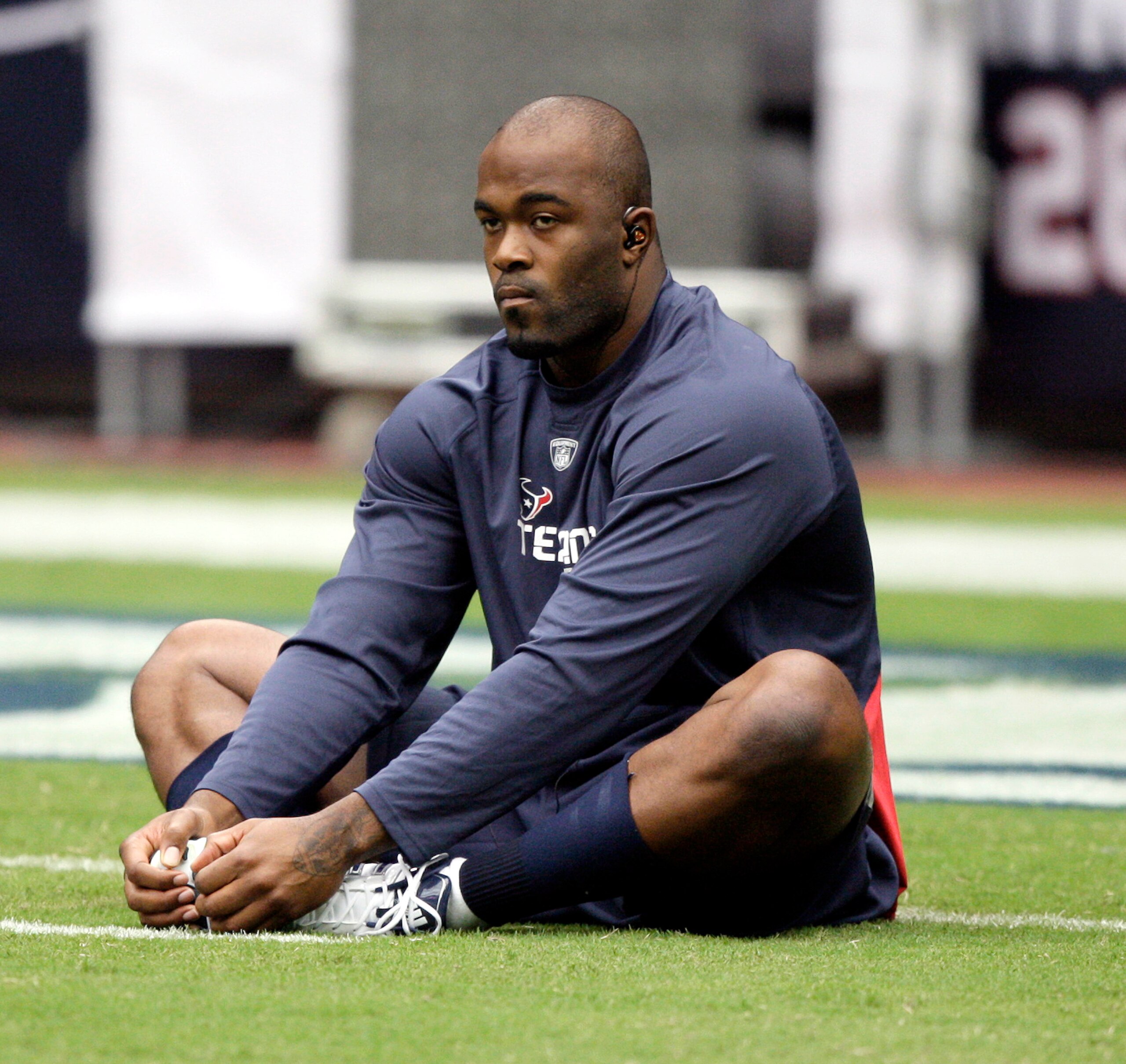 HOUSTON - SEPTEMBER 26:  Defensive end Mario Williams stetches during pre-game warm ups before playing the Dallas Cowboys at Reliant Stadium on September 26, 2010 in Houston, Texas.  (Photo by Bob Levey/Getty Images)