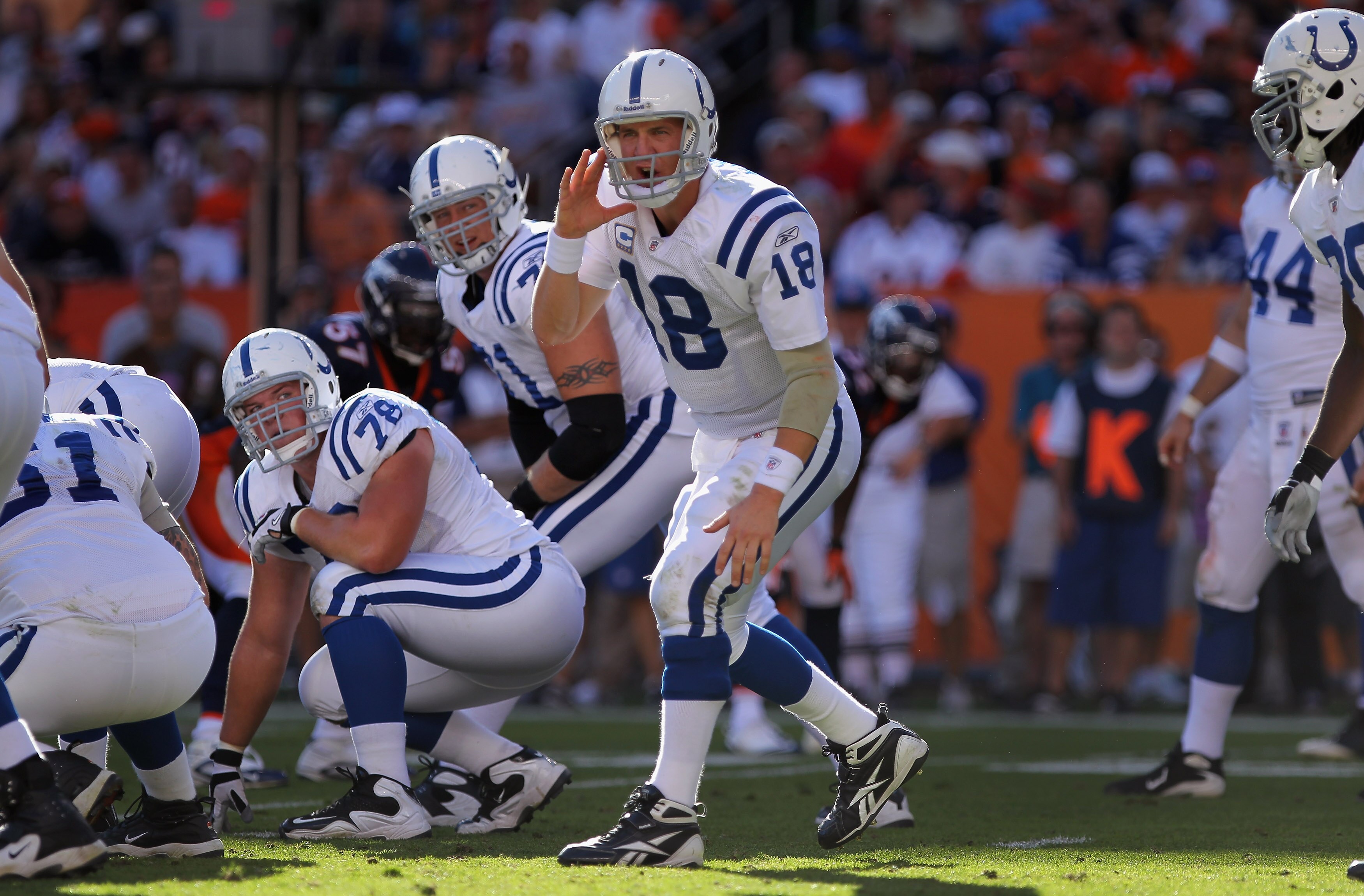 DENVER - SEPTEMBER 26: Quarterback Peyton Manning #18 of the Indianapolis Colts directs the offense against the Denver Broncos at INVESCO Field at Mile High on September 26, 2010 in Denver, Colorado. The Colts defeated the Broncos 27-13. (Photo by Doug DENVER - SEPTEMBER 26: Quarterback Peyton Manning #18 of the Indianapolis Colts directs the offense against the Denver Broncos at INVESCO Field at Mile High on September 26, 2010 in Denver, Colorado. The Colts defeated the Broncos 27-13. (Photo by Doug