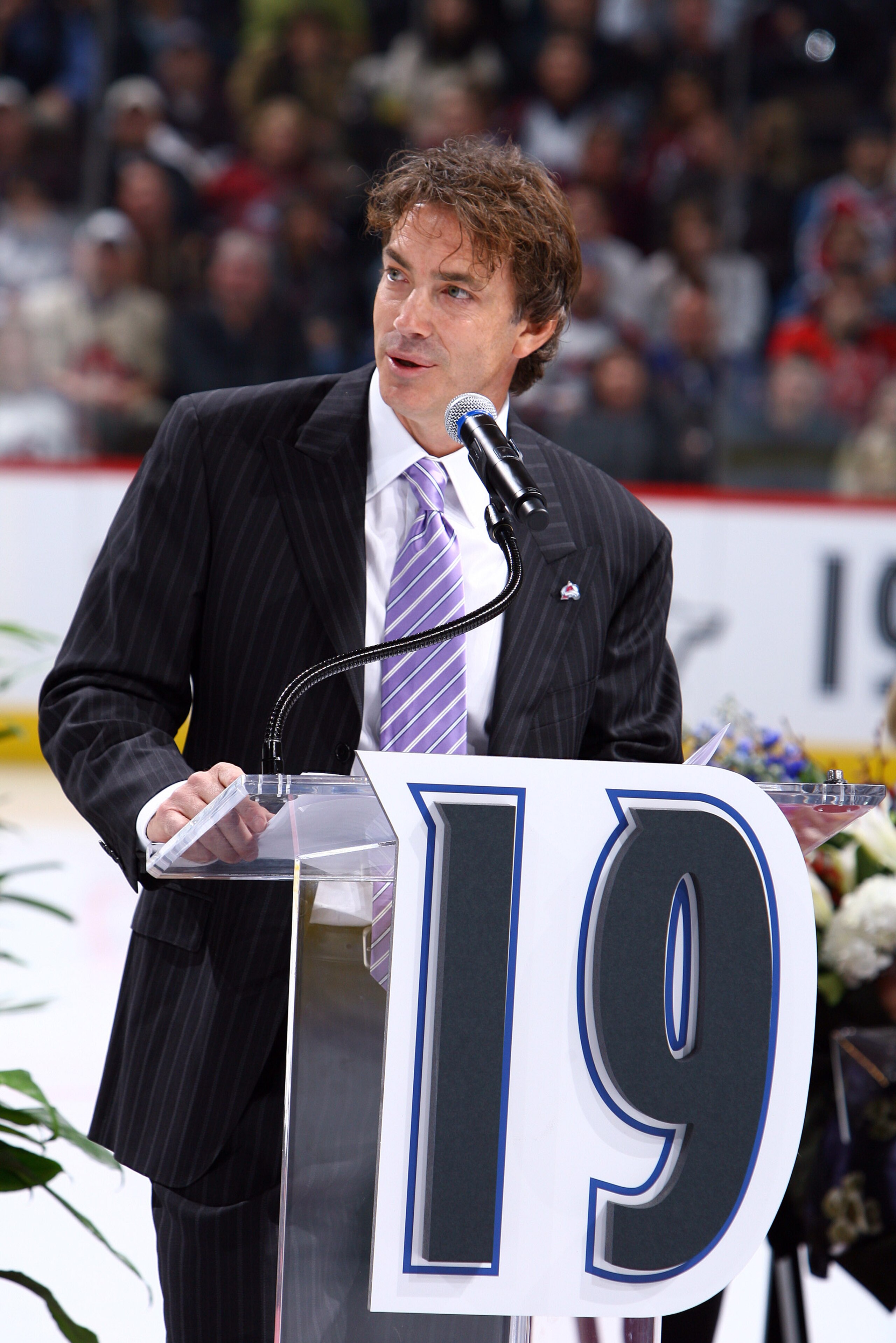 DENVER - OCTOBER 1: Joe Sakic addresses the crowd as his number is retired by the Colorado Avalanche and hoisted to the rafters in a pregame ceremony at the Pepsi Center on October 1, 2009 in Denver, Colorado. NOTE TO USER: User expressly acknowledges and DENVER - OCTOBER 1: Joe Sakic addresses the crowd as his number is retired by the Colorado Avalanche and hoisted to the rafters in a pregame ceremony at the Pepsi Center on October 1, 2009 in Denver, Colorado. NOTE TO USER: User expressly acknowledges and