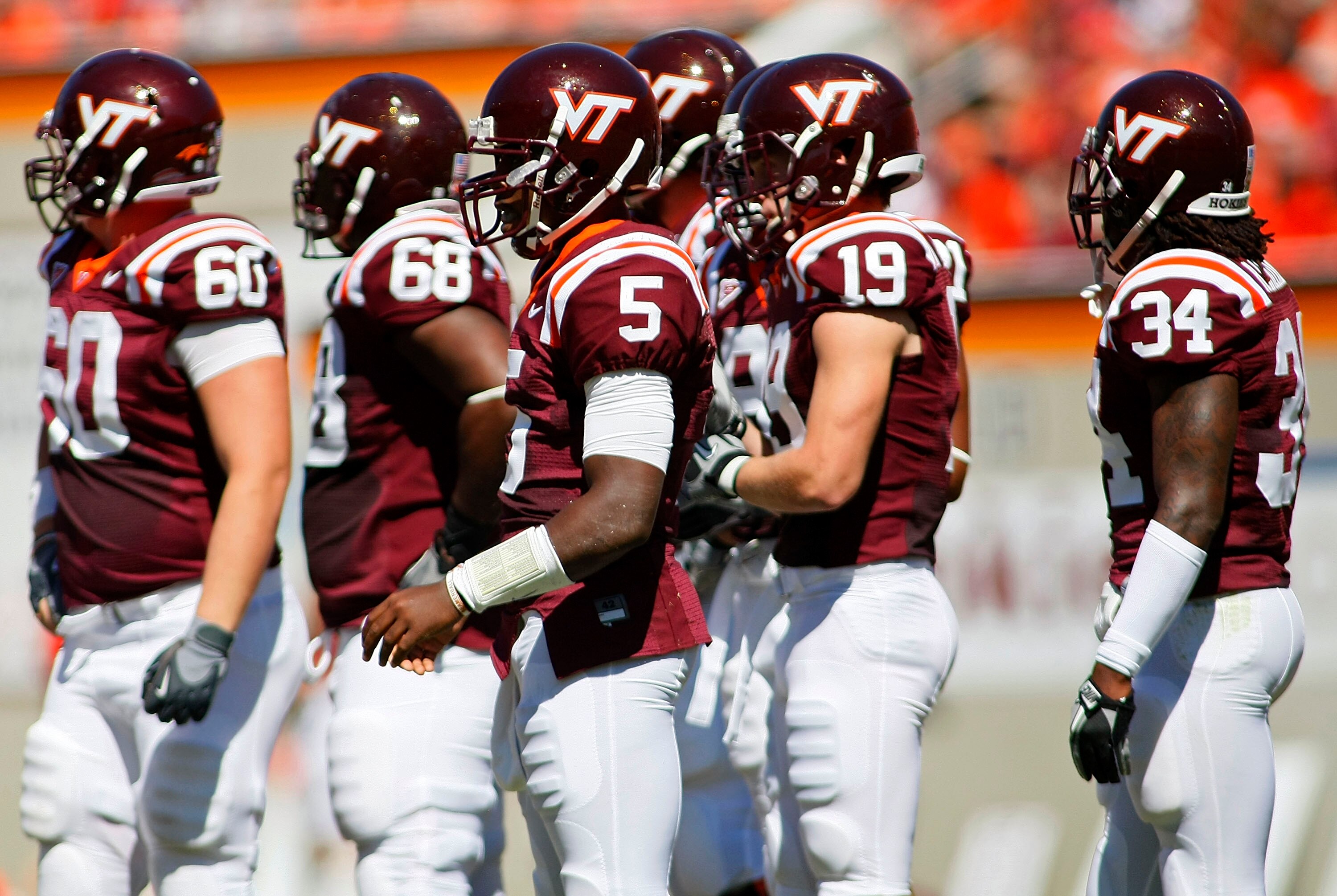 BLACKSBURG, VA - SEPTEMBER 18: Quarterback Tyrod Taylor #5 of the Virginia Tech Hokies stands on field with other members of the Hokies offense during a timeout against the East Carolina Pirates at Lane Stadium on September 18, 2010 in Blacksburg, Virgini