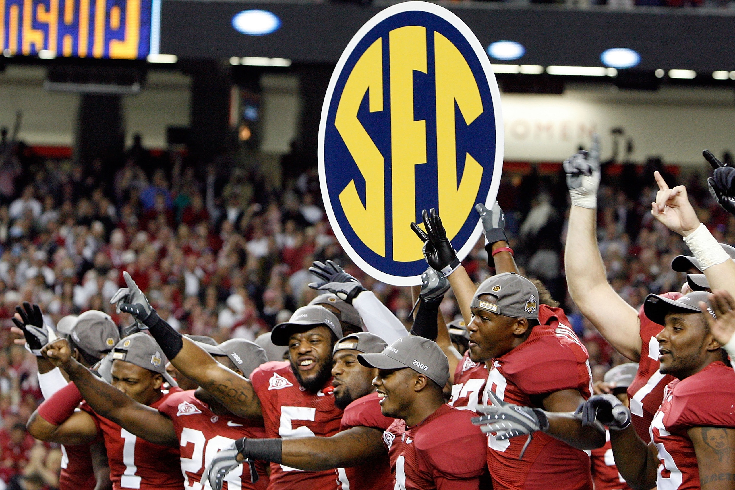 ATLANTA - DECEMBER 05:  Members of the Alabama Crimson Tide celebrate after defeating the Florida Gators 31-13 during the SEC Championship at the Georgia Dome on December 5, 2009 in Atlanta, Georgia.  (Photo by Chris Graythen/Getty Images)