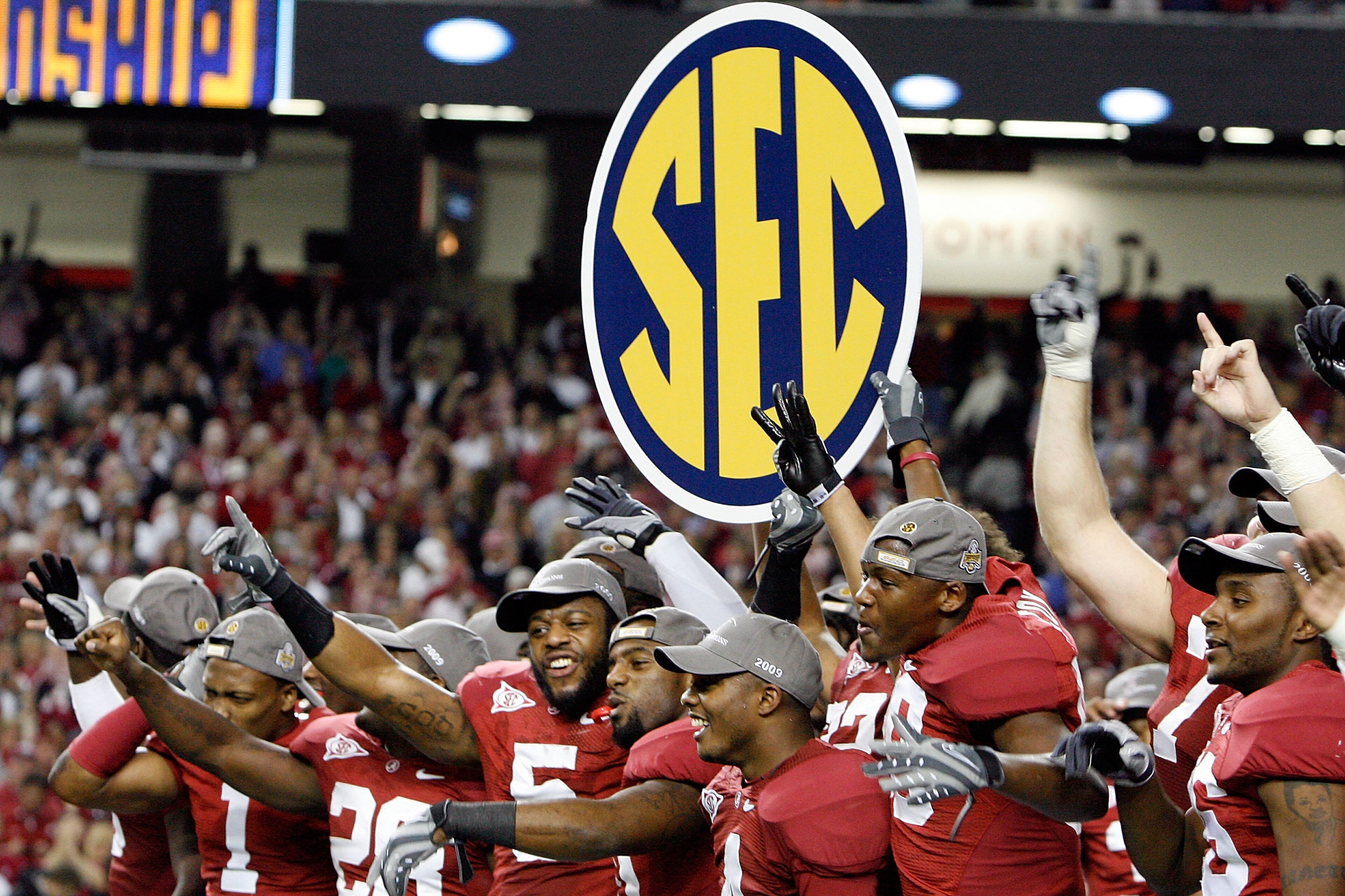 ATLANTA - DECEMBER 05: Members of the Alabama Crimson Tide celebrate after defeating the Florida Gators 31-13 during the SEC Championship at the Georgia Dome on December 5, 2009 in Atlanta, Georgia. (Photo by Chris Graythen/Getty Images) ATLANTA - DECEMBER 05: Members of the Alabama Crimson Tide celebrate after defeating the Florida Gators 31-13 during the SEC Championship at the Georgia Dome on December 5, 2009 in Atlanta, Georgia. (Photo by Chris Graythen/Getty Images)