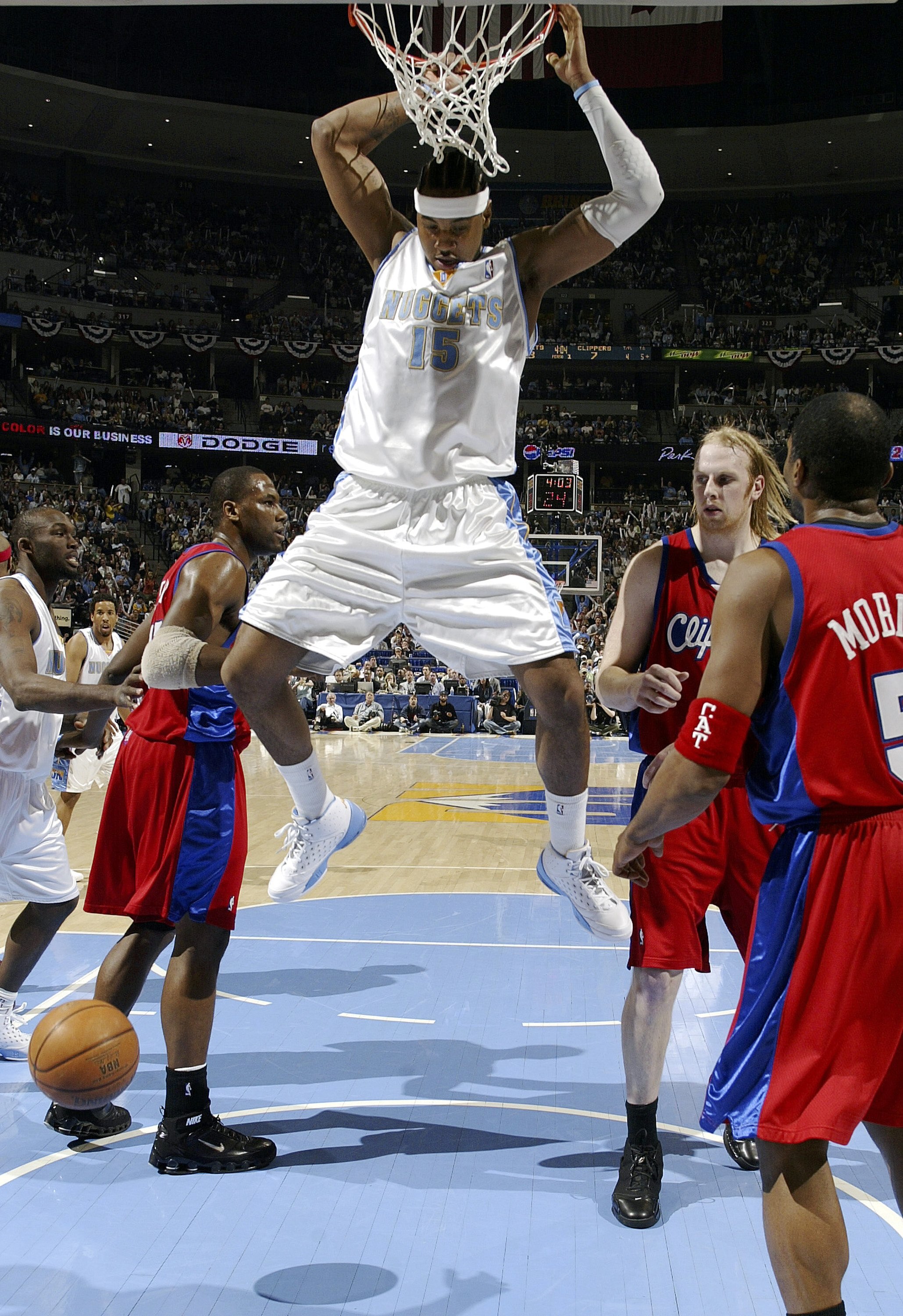 DENVER - APRIL 27:  Carmelo Anthony #15 of the Denver Nuggets looks for a landing zone after dunking on the Los Angeles Clippers in the first quarter of game three of the Western Conference Quarterfinals during the 2006 NBA Playoffs on April 27, 2006 at t