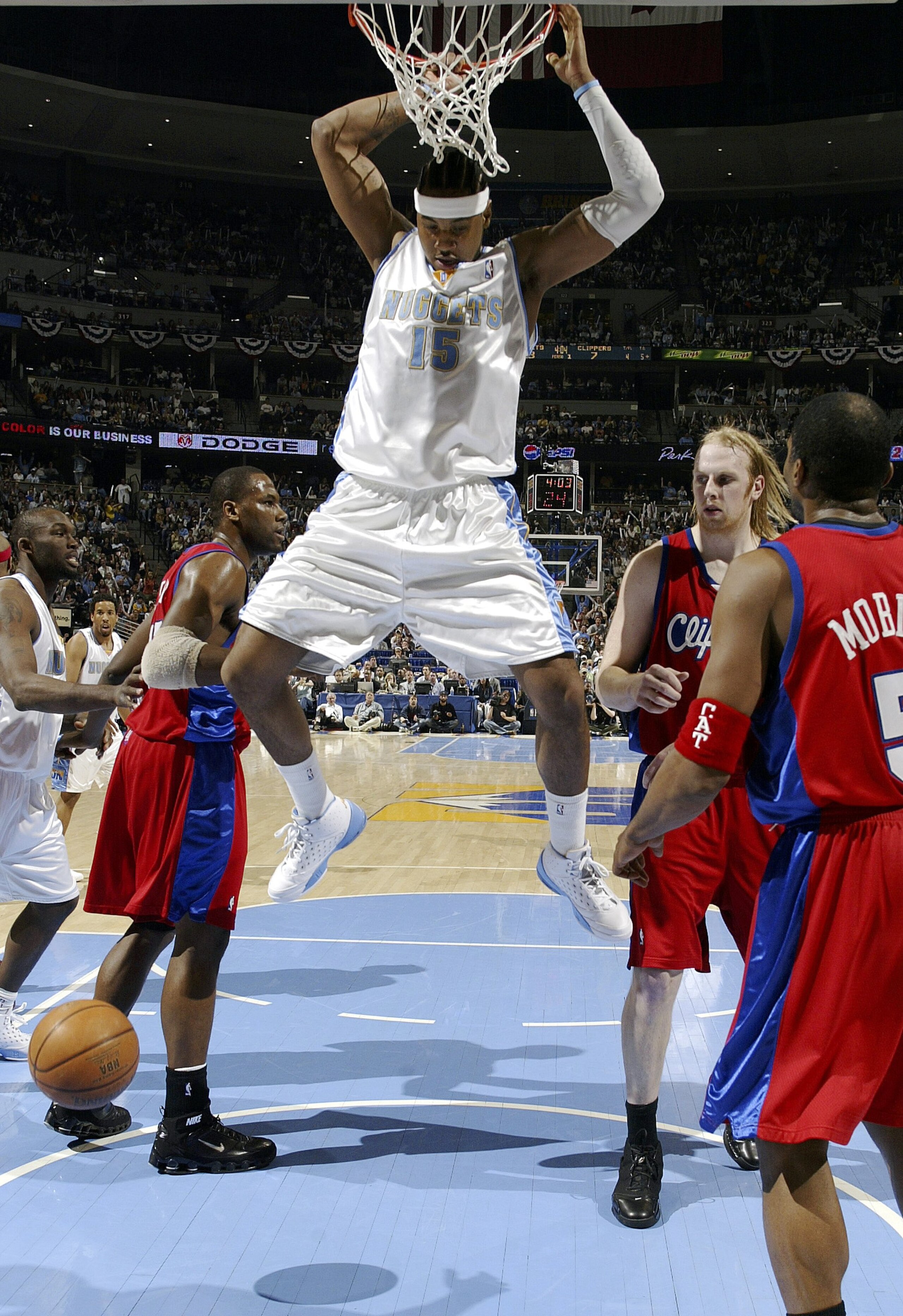 DENVER - APRIL 27:  Carmelo Anthony #15 of the Denver Nuggets looks for a landing zone after dunking on the Los Angeles Clippers in the first quarter of game three of the Western Conference Quarterfinals during the 2006 NBA Playoffs on April 27, 2006 at t