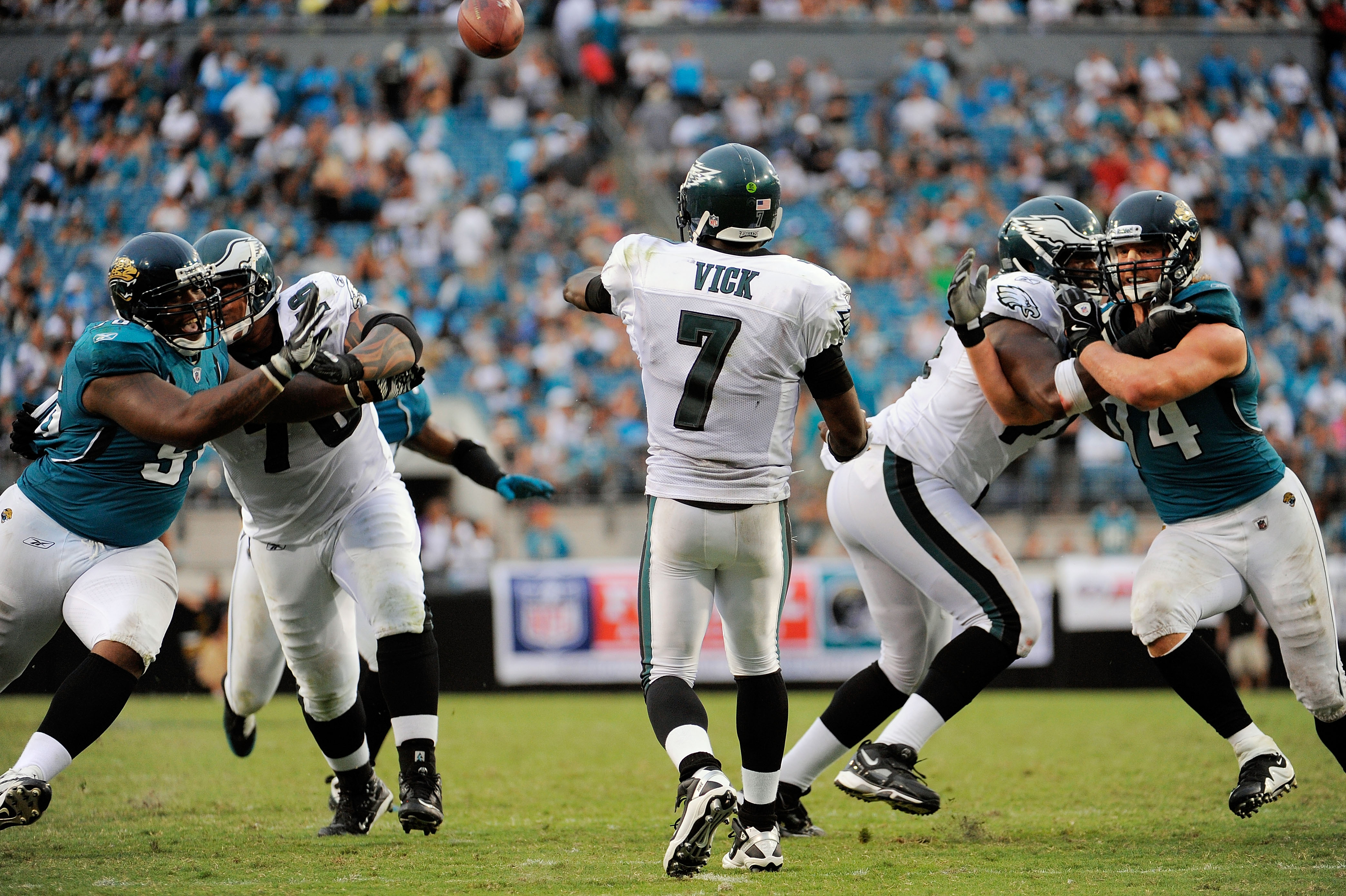 JACKSONVILLE, FL - SEPTEMBER 26:  Quarterback Michael Vick #7 of the Philadelphia Eagles throws a pass while under pressure against the Jacksonville Jaguars at EverBank Field on September 26, 2010 in Jacksonville, Florida. The Eagles defeated the Jaguars