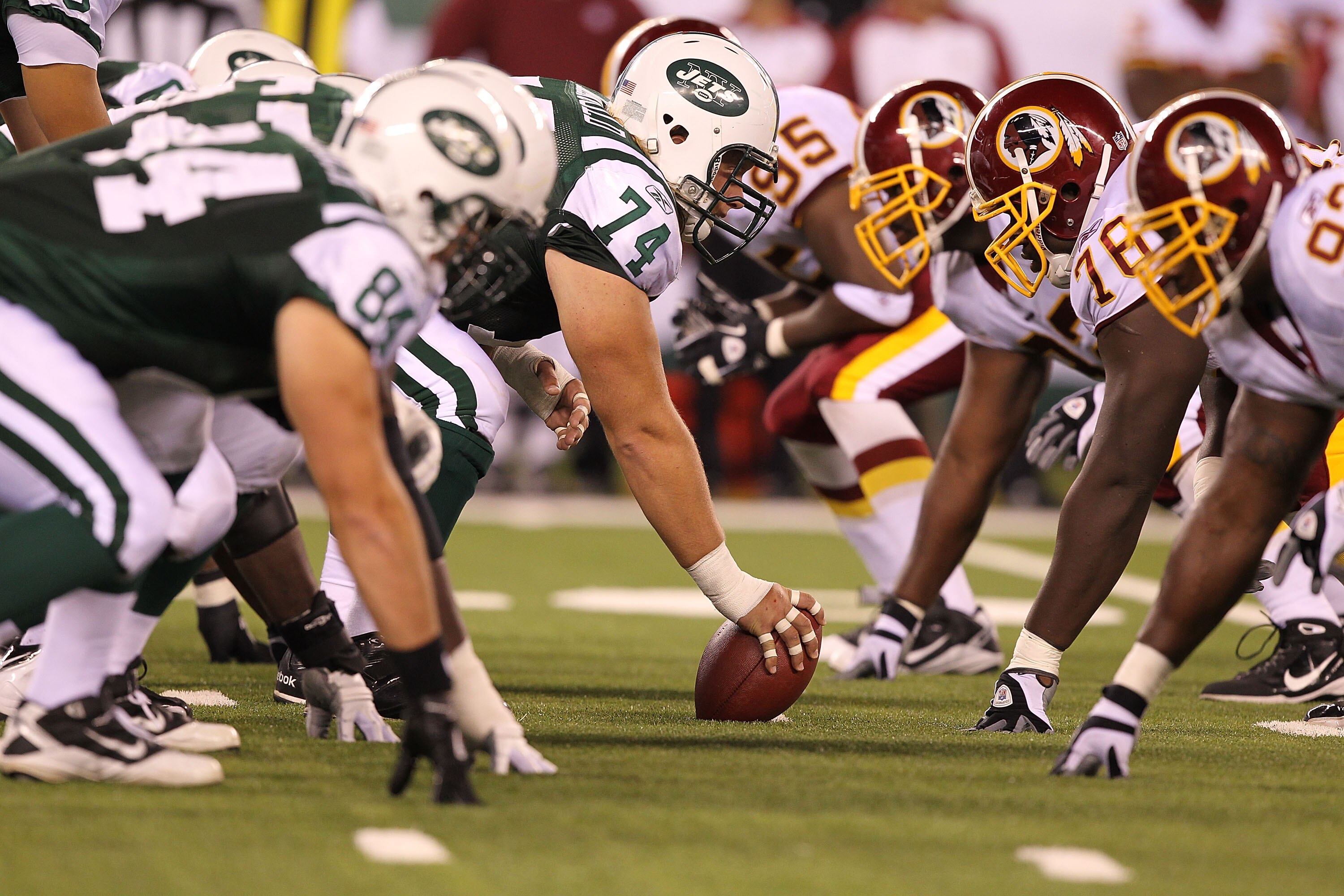 EAST RUTHERFORD, NJ - AUGUST 27:  Nick Mangold #74 of the New York Jets in action against  the Washington Redskins  during their preseason game on August 27, 2010 at the New Meadowlands Stadium  in East Rutherford, New Jersey.  (Photo by Al Bello/Getty Im