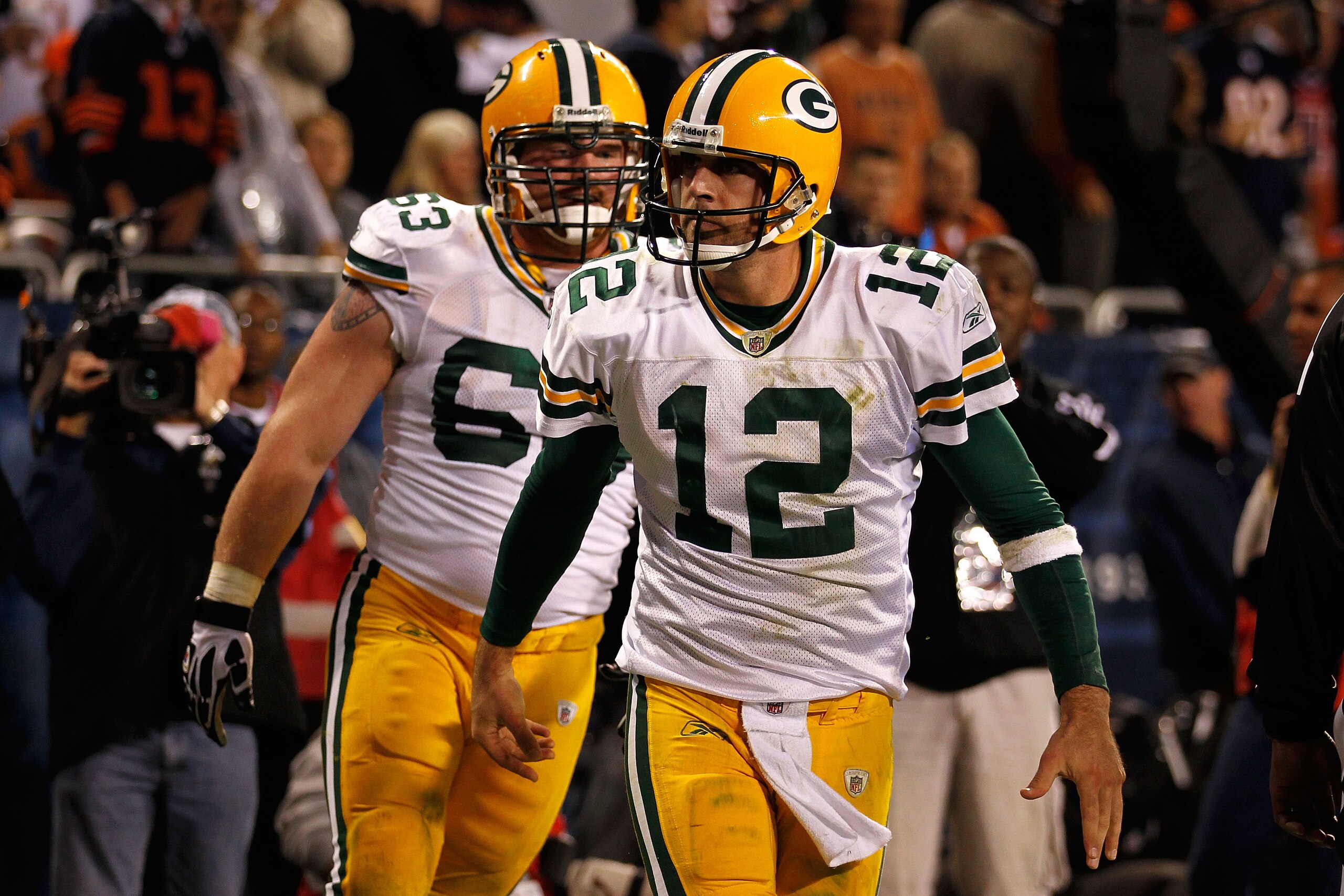 CHICAGO - SEPTEMBER 27:  Aaron Rodgers (R) #12 and Scott Wells #63 of the Green Bay Packers react after Rodgers scored a 3-yard rushing touchdown in the fourth quarter against the Chicago Bears at Soldier Field on September 27, 2010 in Chicago, Illinois.