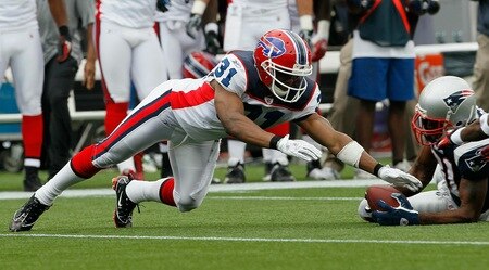 Jairus Byrd takes this fumble away from Randy Moss in the pile