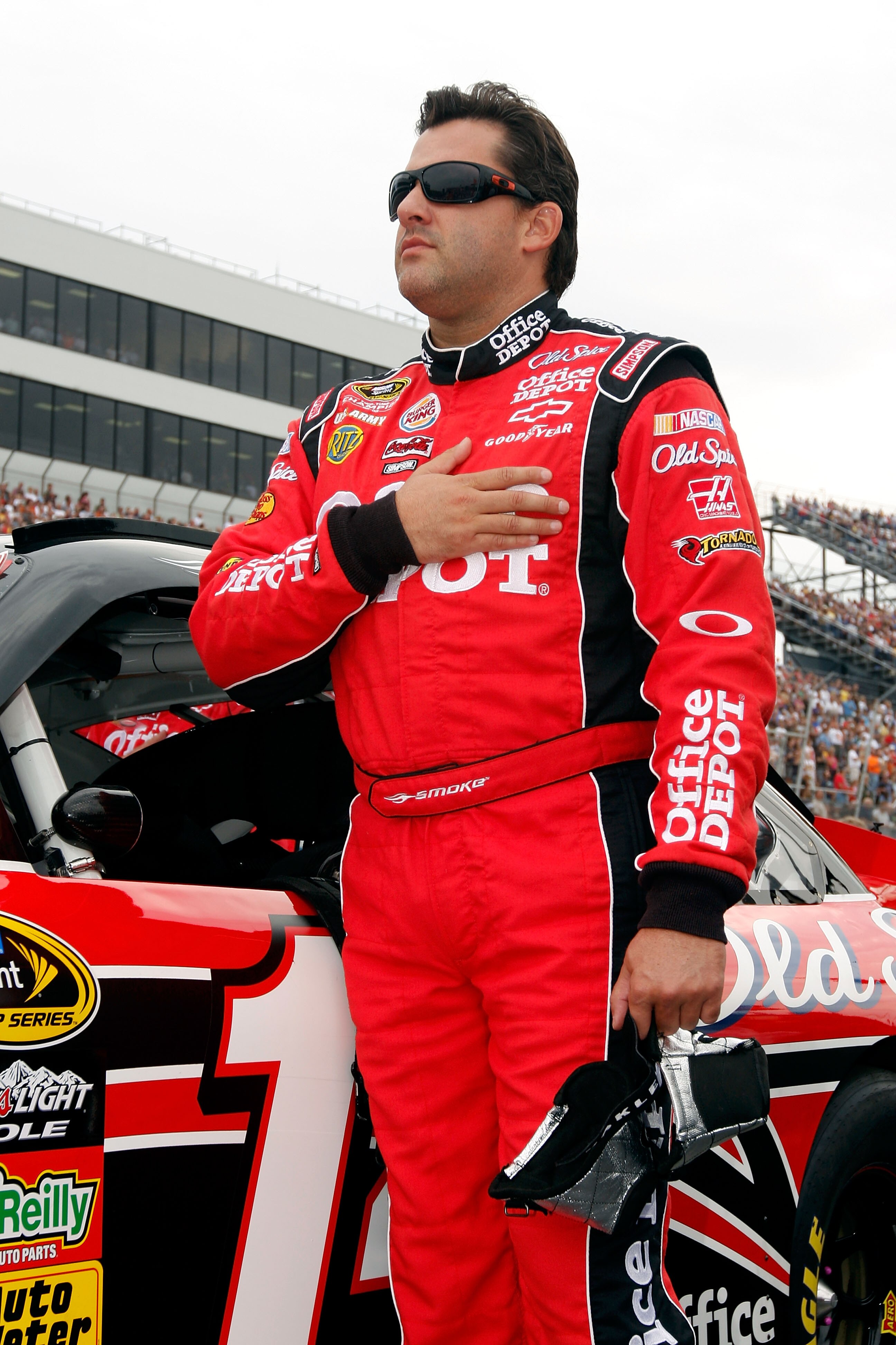 DOVER, DE - SEPTEMBER 26:  Tony Stewart, driver of the #14 Office Depot/Old Spice Chevrolet,  stands on the grid prior to the NASCAR Sprint Cup Series AAA 400 at Dover International Speedway on September 26, 2010 in Dover, Delaware.  (Photo by Justin Heim