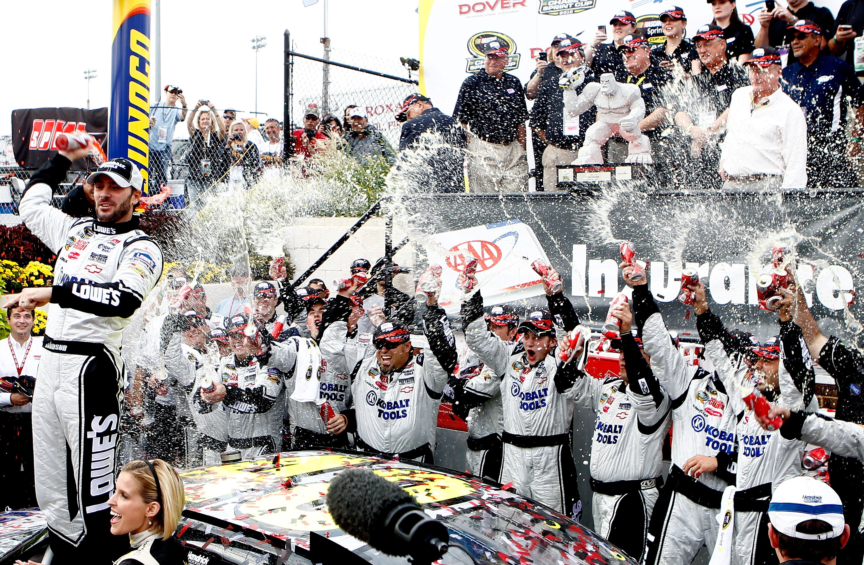 DOVER, DE - SEPTEMBER 26:  Jimmie Johnson, driver of the #48 Lowe's Chevrolet, celebrates in Victory Lane after winning the NASCAR Sprint Cup Series AAA 400 at Dover International Speedway on September 26, 2010 in Dover, Delaware.  (Photo by Jeff Zelevans