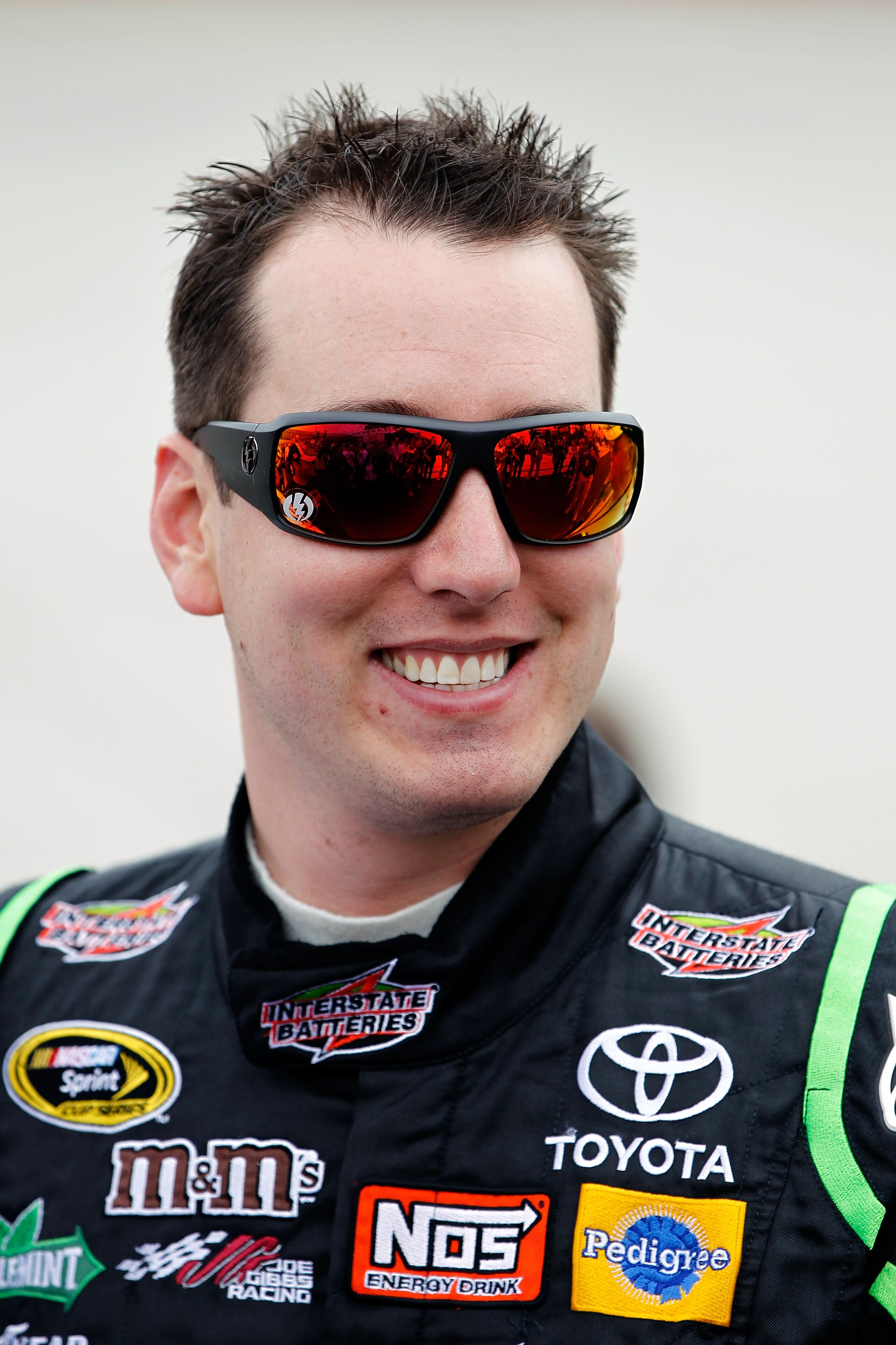 DOVER, DE - SEPTEMBER 26:  Kyle Busch, driver of the #18 Interstate Batteries Toyota, stands on the grid prior to the NASCAR Sprint Cup Series AAA 400 at Dover International Speedway on September 26, 2010 in Dover, Delaware.  (Photo by Jeff Zelevansky/Get