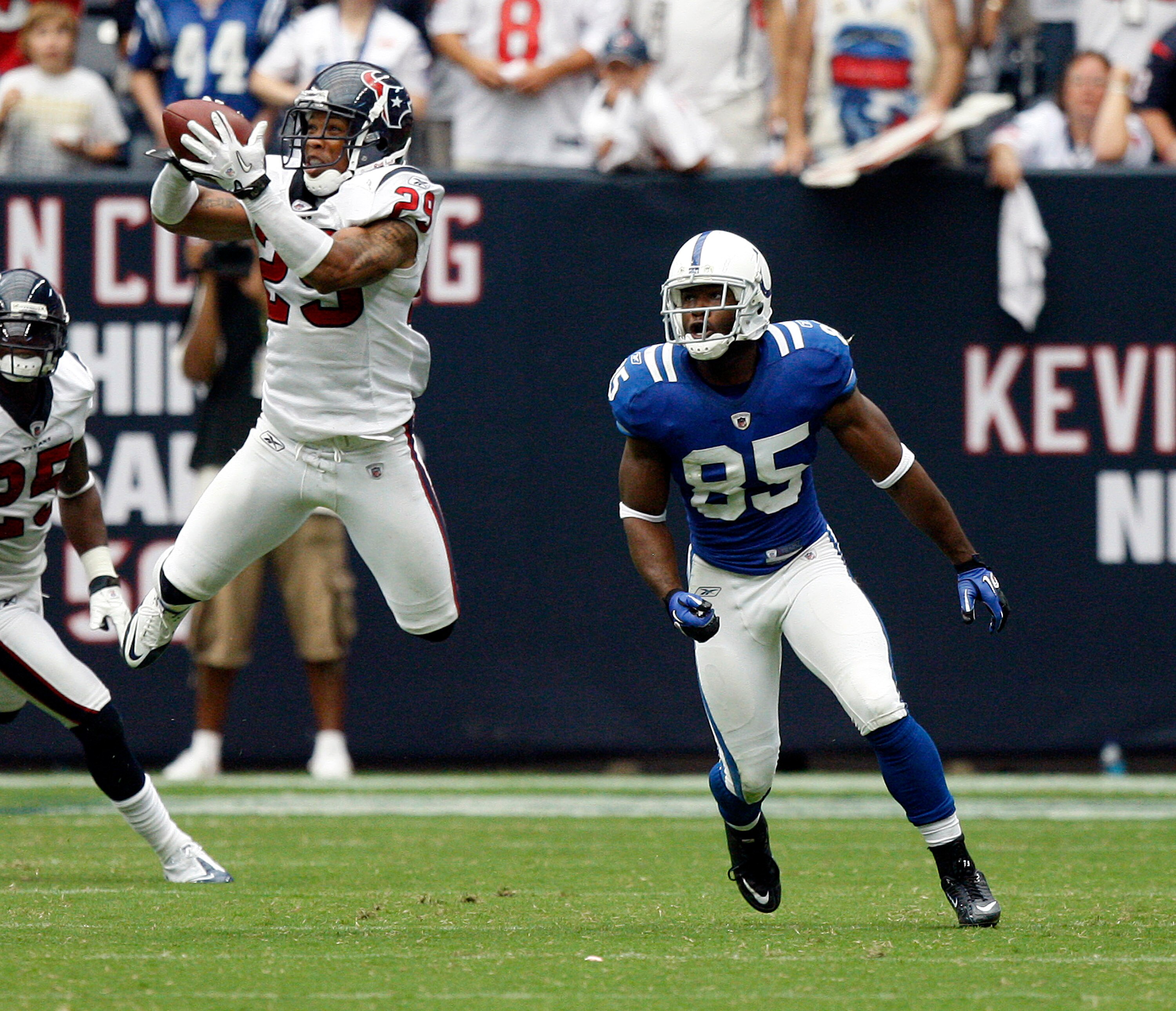 HOUSTON - SEPTEMBER 12:  Cornerback Glover Quin  #29 of the Houston Texans steps in front of wide receiver Pierre Garcon #85 of the Indianapolis Colts during the NFL season opener at Reliant Stadium on September 12, 2010 in Houston, Texas.  (Photo by Bob