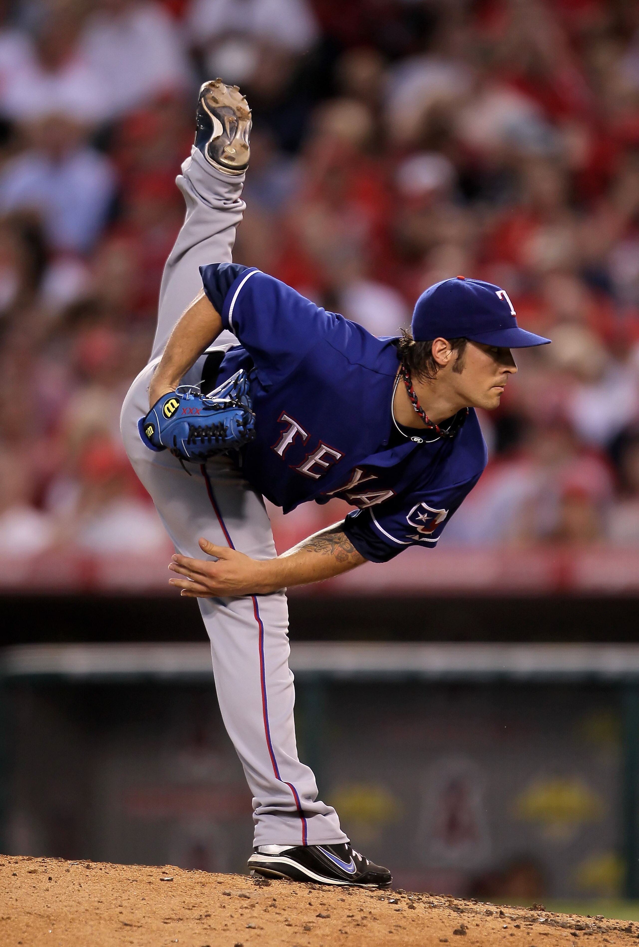 ANAHEIM, CA - JULY 01:  C.J. Wilson #36 of the Texas Rangers pitches against the Los Angeles Angels of Anaheim in the fourth inning at Anaheim Stadium on July 1, 2010 in Anaheim, California.  (Photo by Jeff Gross/Getty Images)