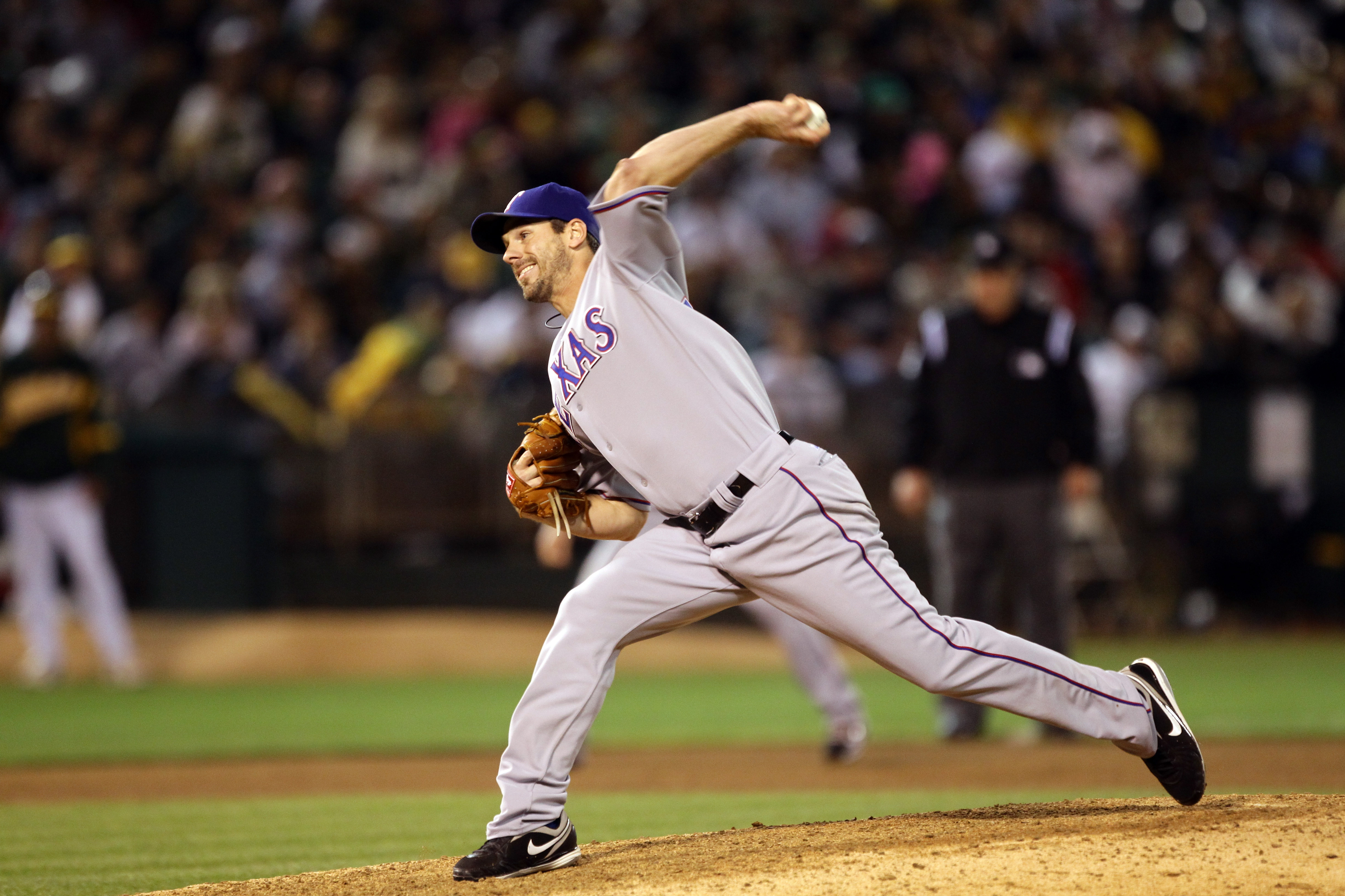 OAKLAND, CA - AUGUST 06: Cliff Lee #33 of the Texas Rangers pitches against the Oakland Athletics at the Oakland-Alameda County Coliseum on August 6, 2010 in Oakland, California. (Photo by Ezra Shaw/Getty Images) OAKLAND, CA - AUGUST 06: Cliff Lee #33 of the Texas Rangers pitches against the Oakland Athletics at the Oakland-Alameda County Coliseum on August 6, 2010 in Oakland, California. (Photo by Ezra Shaw/Getty Images)