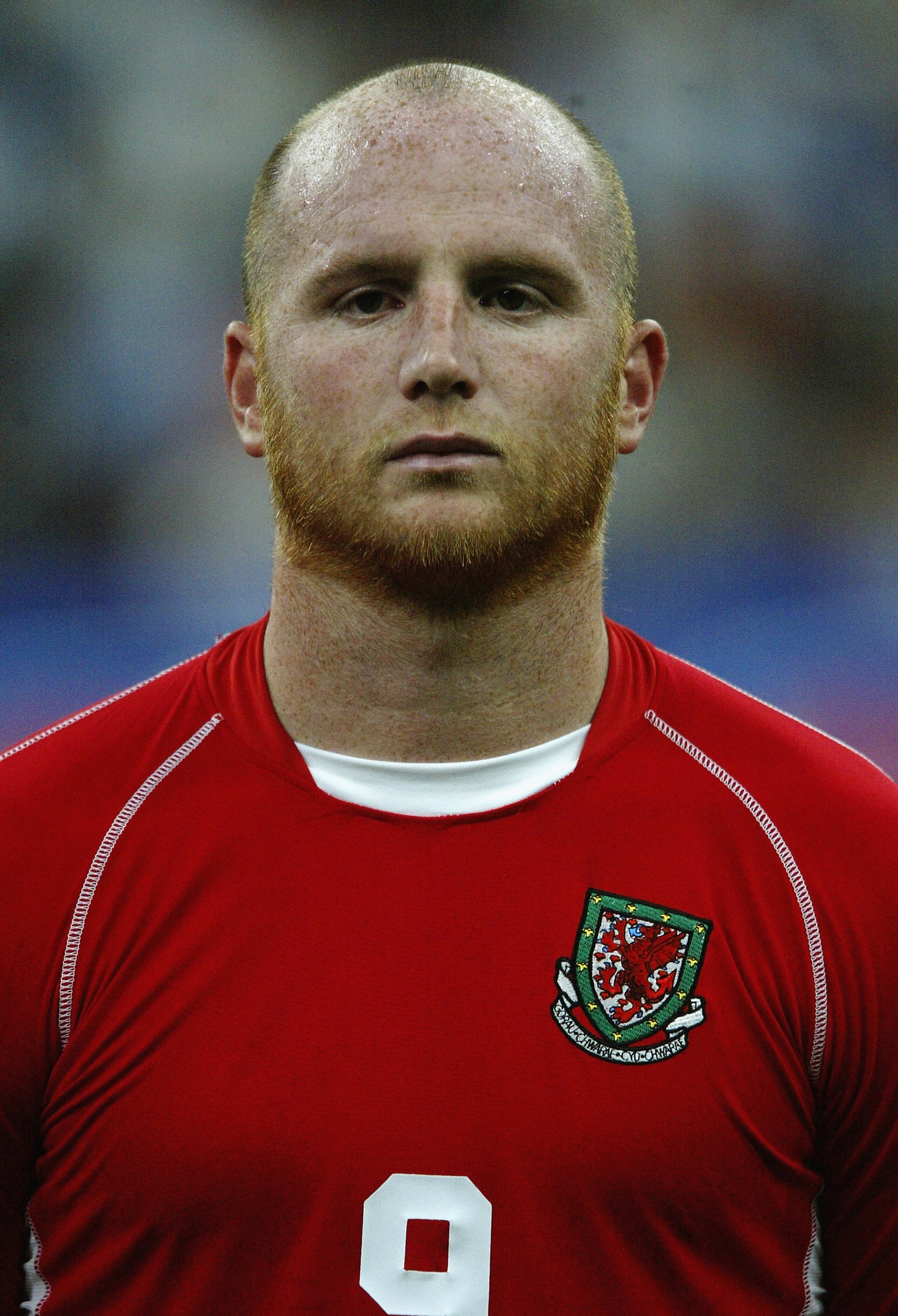 MILAN - SEPTEMBER 6:  John Hartson of Wales during the team line-up during the Euro 2004 Qualifying Group 9 match between Italy and Wales on September 6, 2003 at the San Siro in Milan, Italy.  Italy won the match 4-0.  (Photo by Mark Thompson/Getty Images