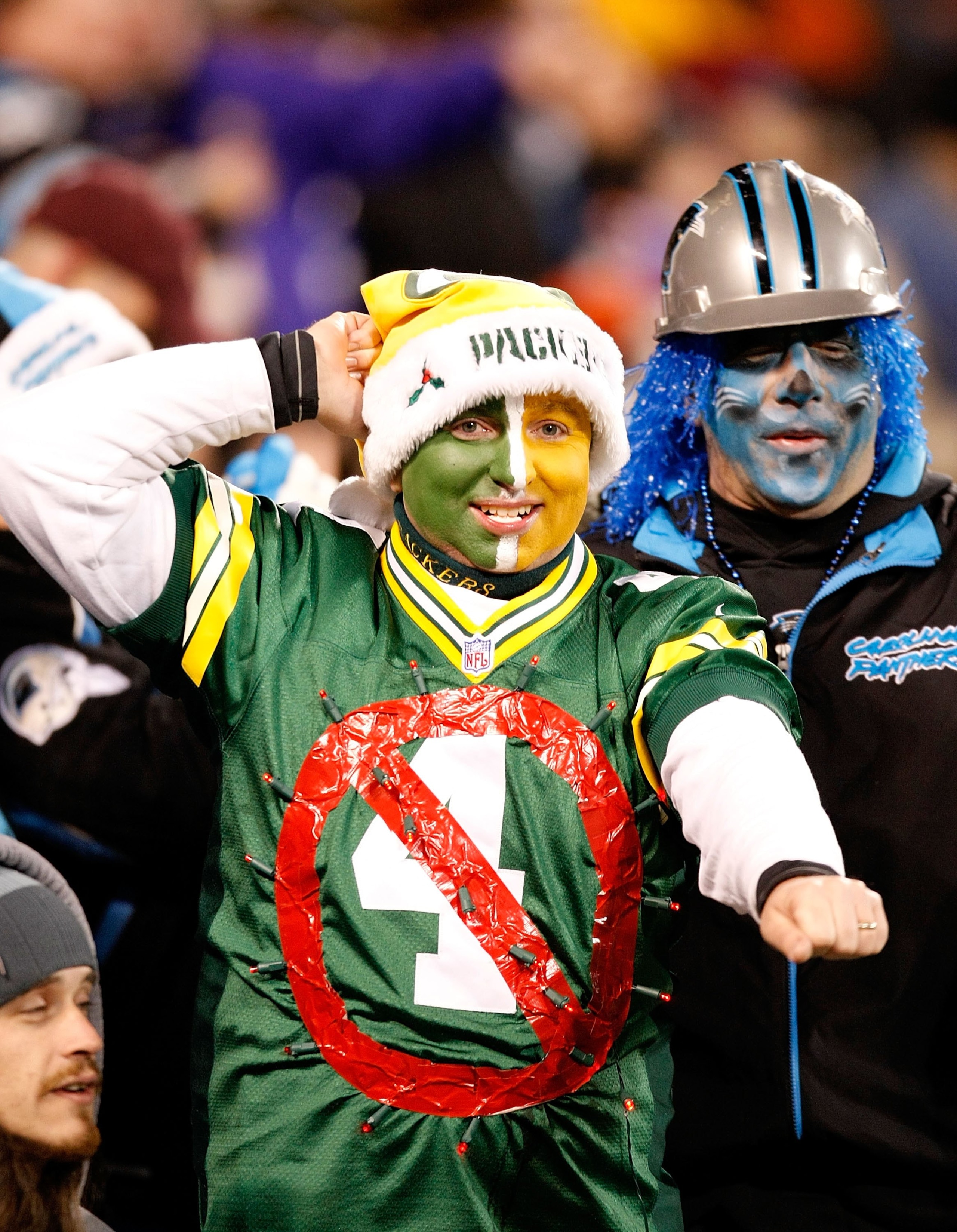 CHARLOTTE, NC - DECEMBER 20: A Green Bay Packers fan wears an old jersey of quarterback Brett Favre (not pictured) #4 of the Minnesota Vikings during the game against the Carolina Panthers at Bank of America Stadium on December 20, 2009 in Charlotte, Nor CHARLOTTE, NC - DECEMBER 20: A Green Bay Packers fan wears an old jersey of quarterback Brett Favre (not pictured) #4 of the Minnesota Vikings during the game against the Carolina Panthers at Bank of America Stadium on December 20, 2009 in Charlotte, Nor