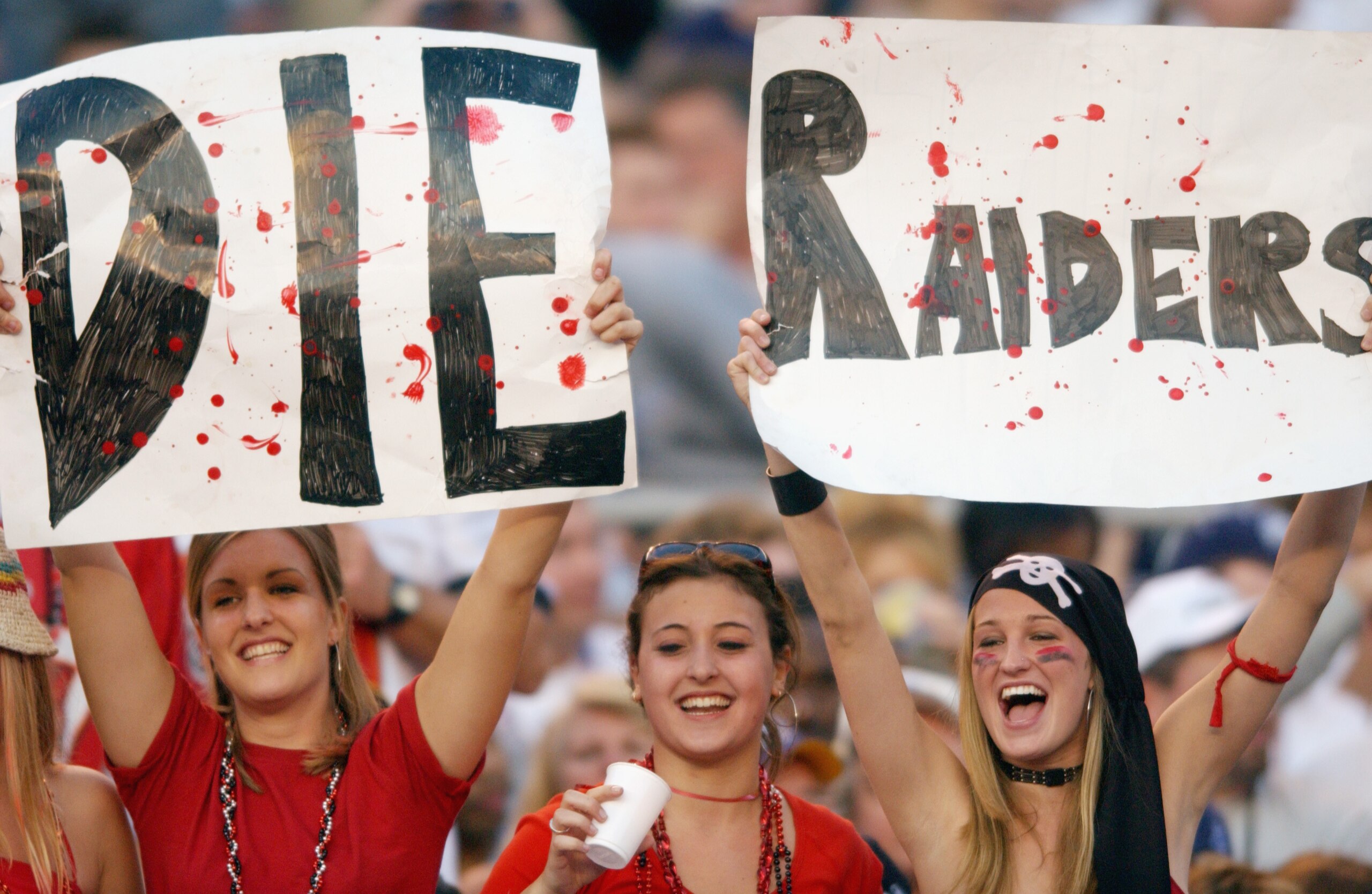 SAN DIEGO - JANUARY 26: Three female fans of the Tampa Bay Buccaneers show their hate for the Oakland Raiders during Super Bowl XXXVII on January 26, 2003 at Qualcomm Stadium in San Diego, California. The Buccaneers defeated the Raiders 48-21. (Photo by SAN DIEGO - JANUARY 26: Three female fans of the Tampa Bay Buccaneers show their hate for the Oakland Raiders during Super Bowl XXXVII on January 26, 2003 at Qualcomm Stadium in San Diego, California. The Buccaneers defeated the Raiders 48-21. (Photo by