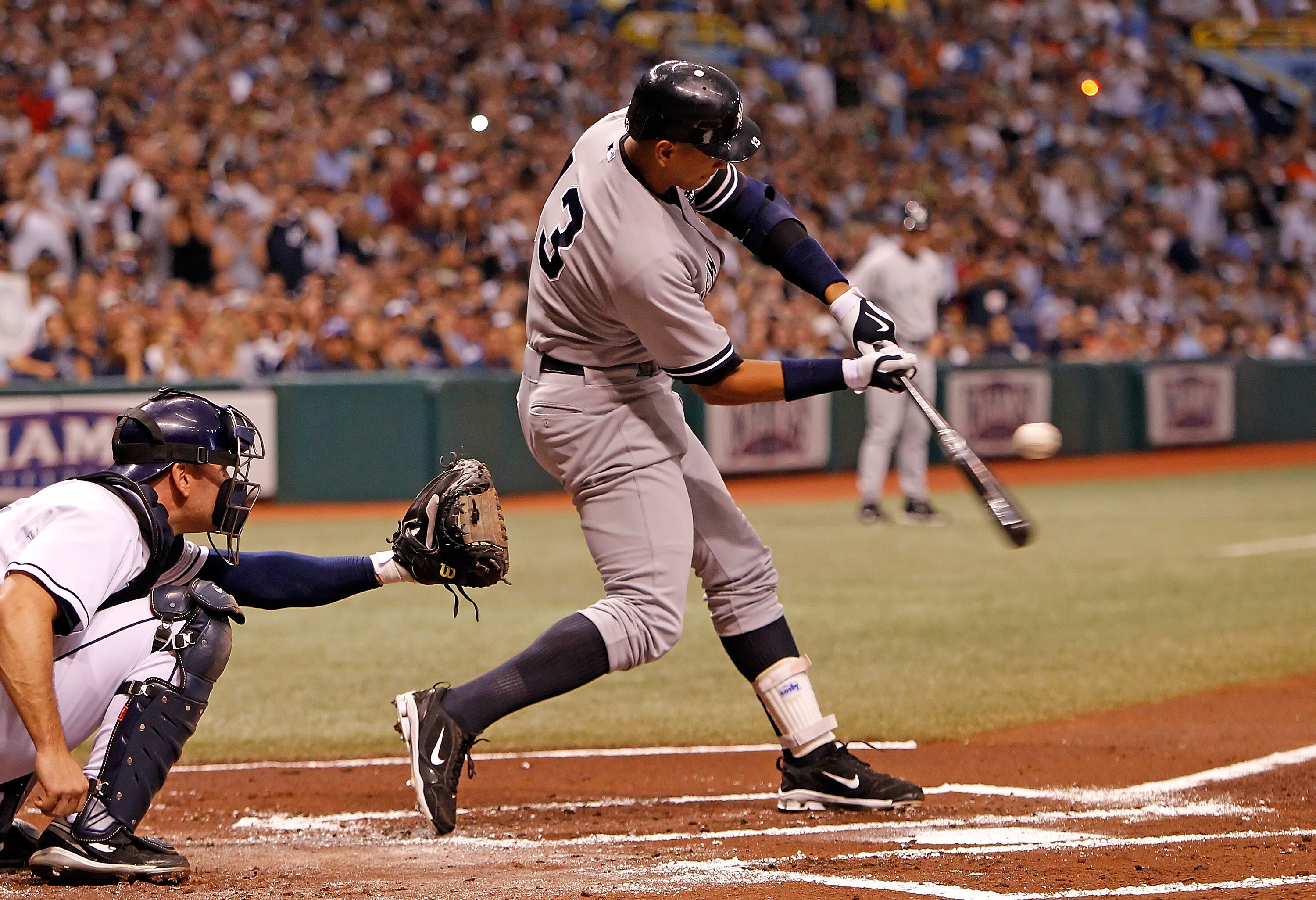 ST PETERSBURG, FL - JULY 30:  Infielder Alex Rodriguez #13 of the New York Yankees fouls off a pitch against the Tampa Bay Rays during the game at Tropicana Field on July 30, 2010 in St. Petersburg, Florida.  (Photo by J. Meric/Getty Images)
