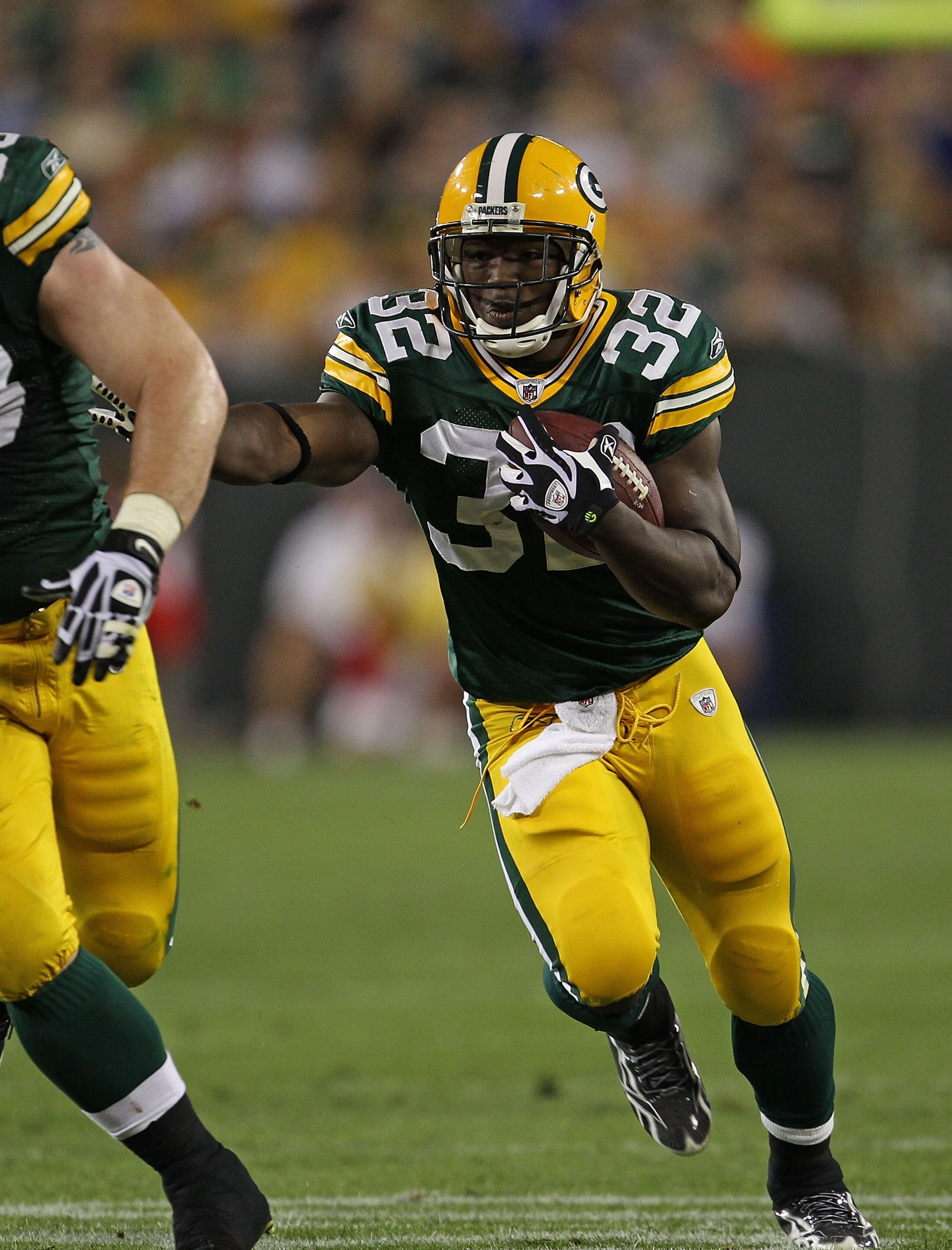 GREEN BAY, WI - AUGUST 26: Brandon Jackson #32 of the Green Bay Packers runs against the Indianapolis Colts during a preseason game at Lambeau Field on August 26, 2010 in Green Bay, Wisconsin. The Packers defeated the Colts 59-24.  (Photo by Jonathan Dani