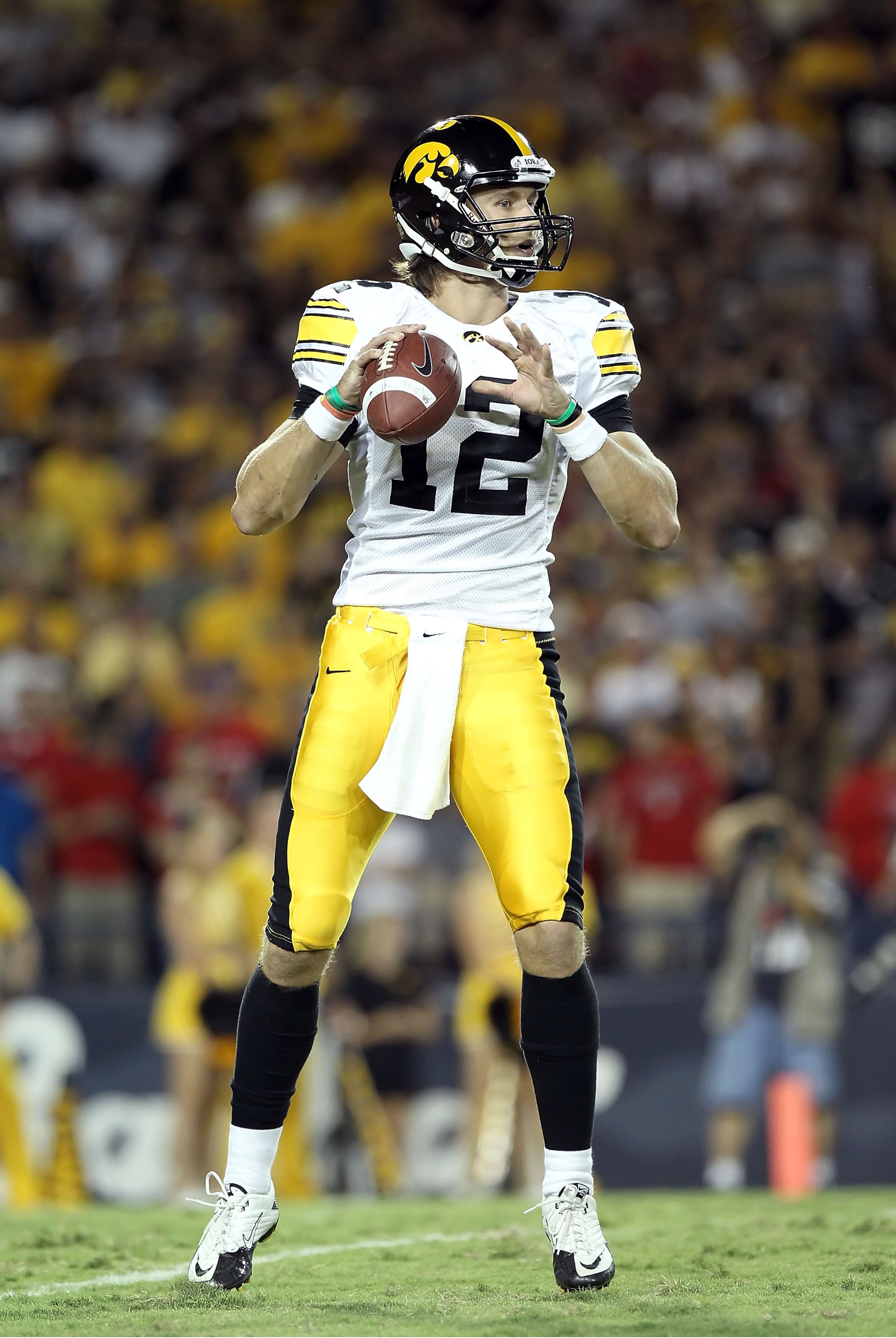 TUCSON, AZ - SEPTEMBER 18:  Quarterback Ricky Stanzi #12 of the Iowa Hawkeyes in action during the college football game against the Arizona Wildcats at Arizona Stadium on September 18, 2010 in Tucson, Arizona.  The Wildcats defeated the Hawkeyes 34-27.