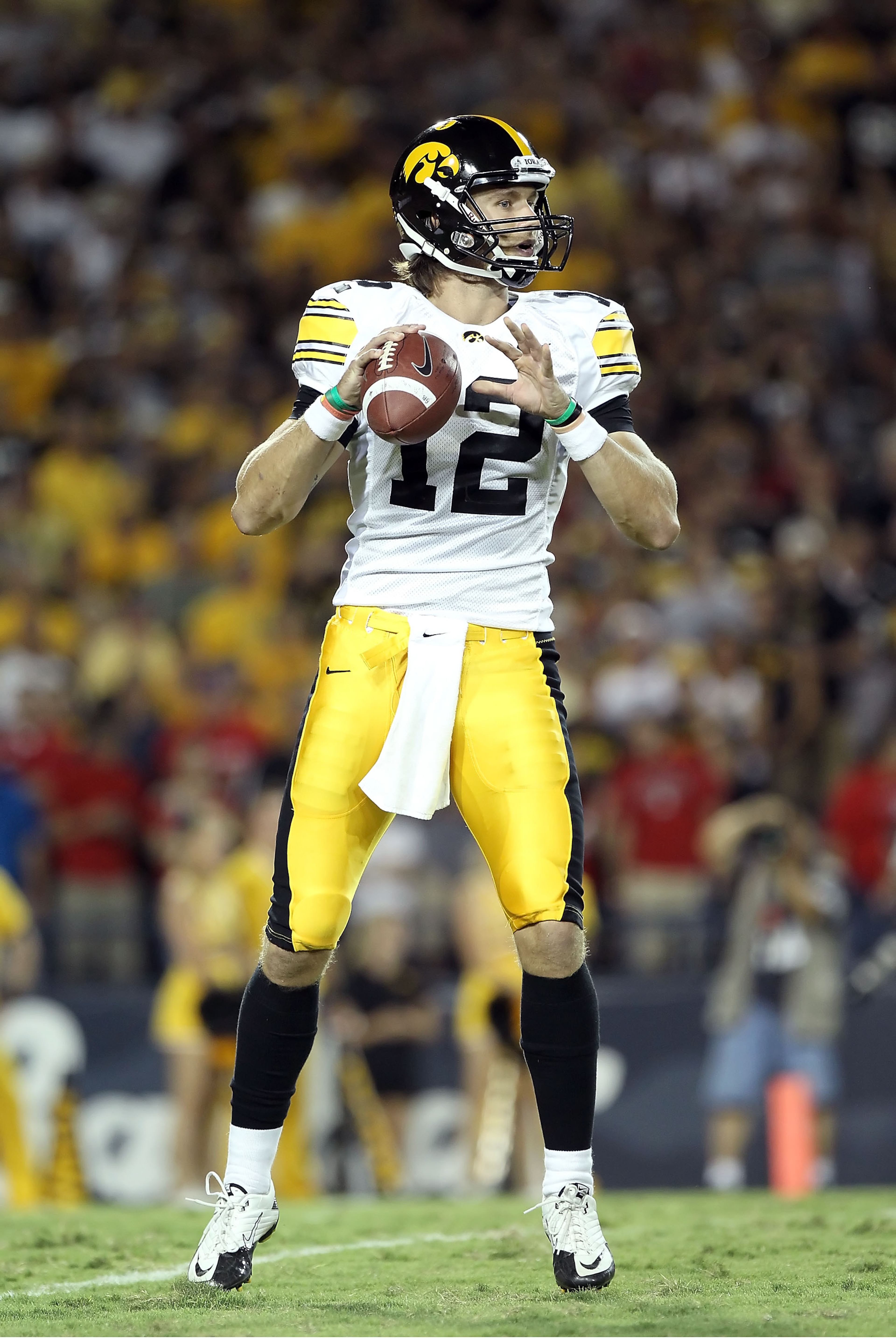 TUCSON, AZ - SEPTEMBER 18:  Quarterback Ricky Stanzi #12 of the Iowa Hawkeyes in action during the college football game against the Arizona Wildcats at Arizona Stadium on September 18, 2010 in Tucson, Arizona.  The Wildcats defeated the Hawkeyes 34-27.