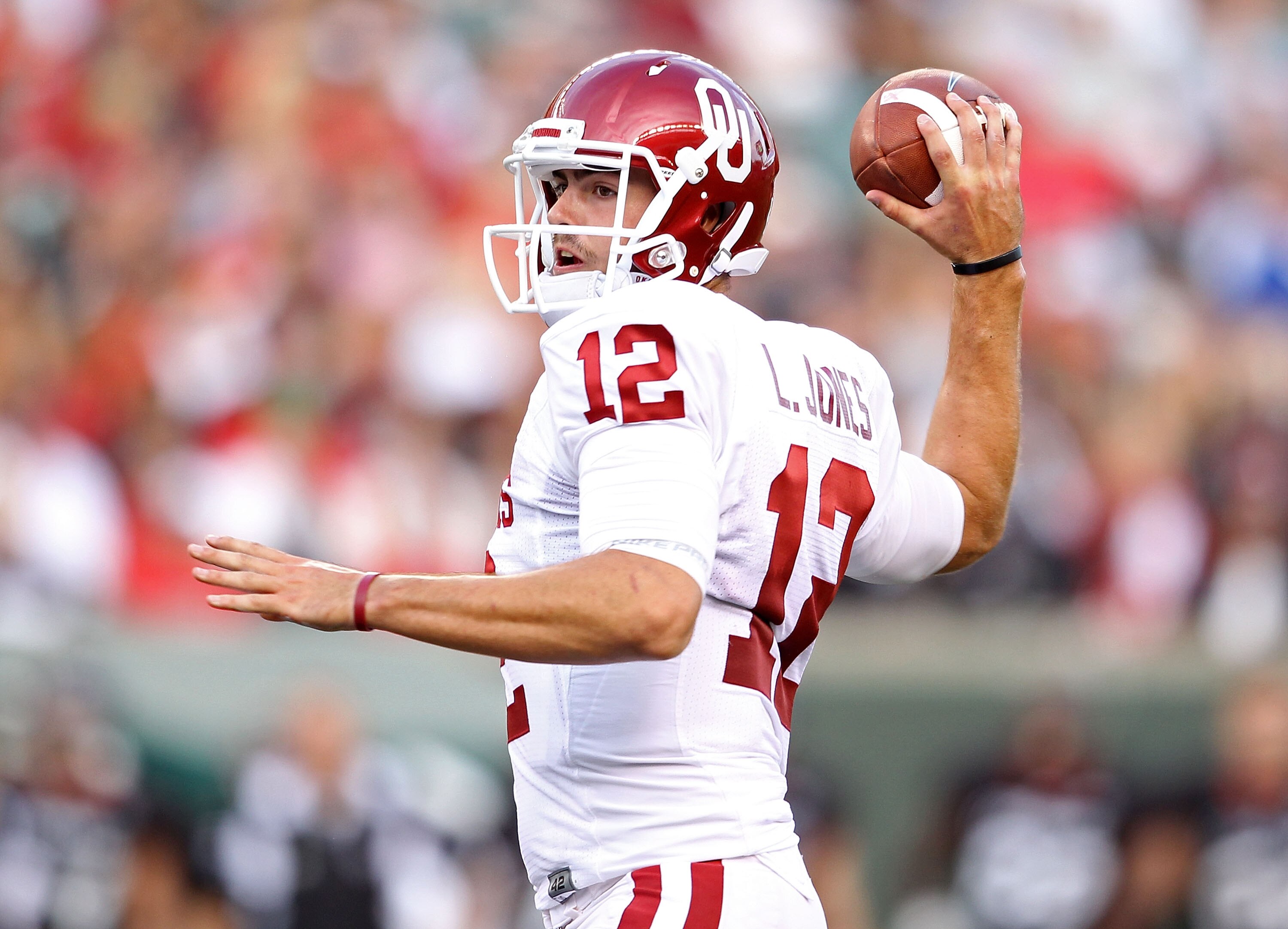 CINCINNATI - SEPTEMBER 25:  Landry Jones #12 of the Oklahoma Sooners throws a pass during the game against the Cincinnati Bearcats at Paul Brown Stadium on September 25, 2010 in Cincinnati, Ohio.  (Photo by Andy Lyons/Getty Images)