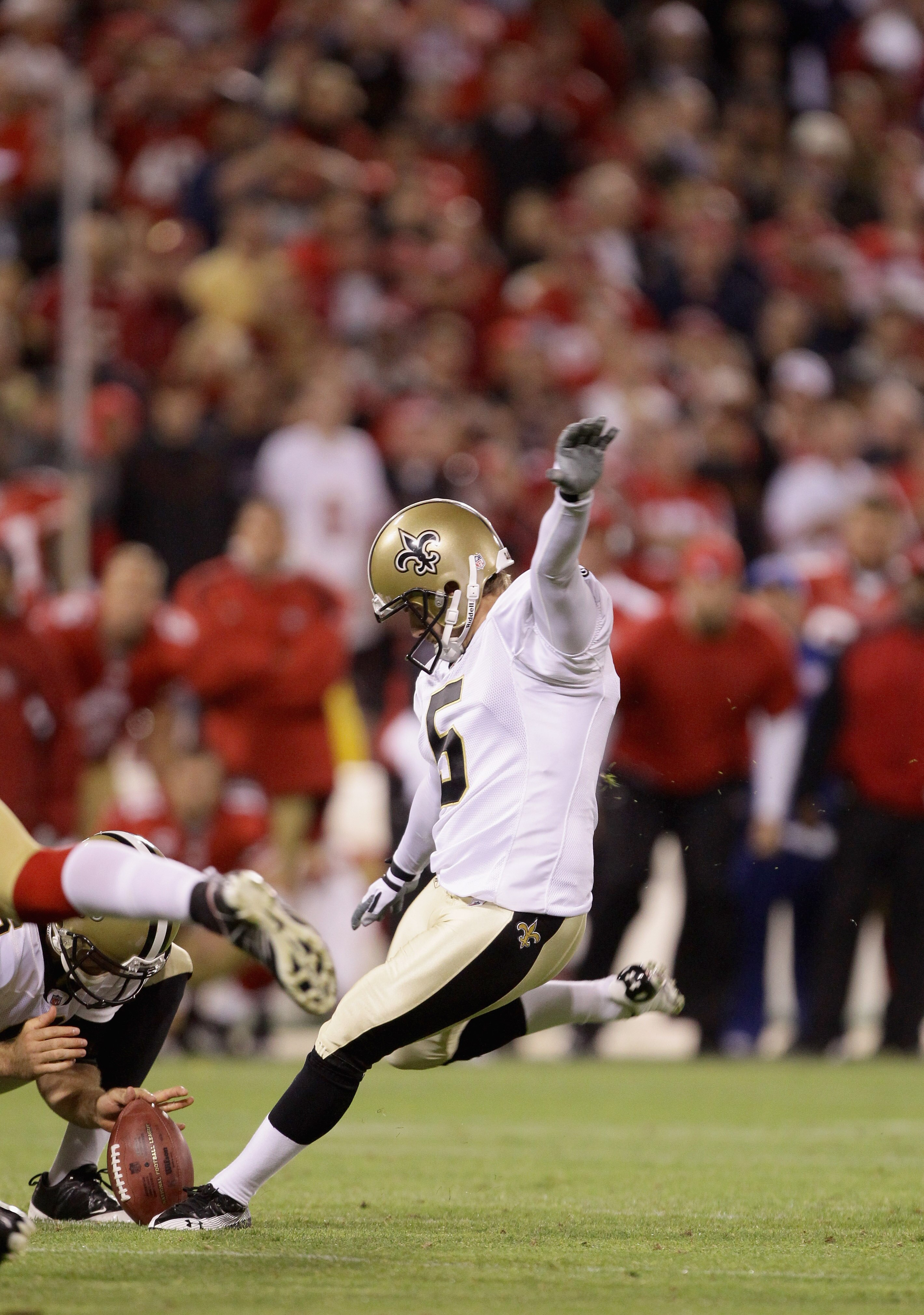 SAN FRANCISCO - SEPTEMBER 20:  Garrett Hartley #5 of the New Orleans Saints kicks the game winning field goal against the San Francisco 49ers at Candlestick Park on September 20, 2010 in San Francisco, California.  (Photo by Ezra Shaw/Getty Images)