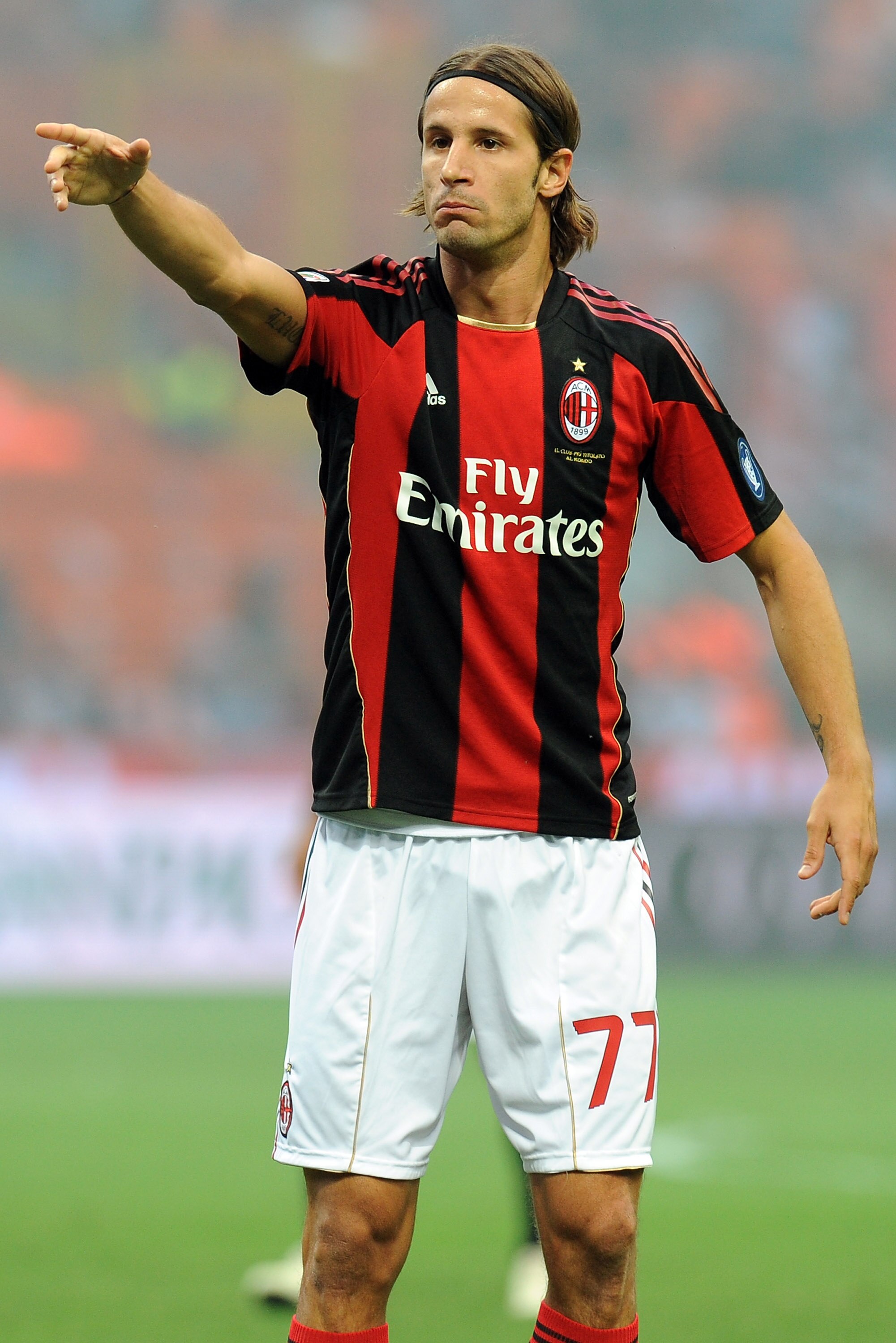MILAN, ITALY - SEPTEMBER 26:  Luca Antonini of Milan gestures during the Serie A match between Milan and Genoa at Stadio Giuseppe Meazza on September 26, 2010 in Milan, Italy.  (Photo by Tullio M. Puglia/Getty Images)