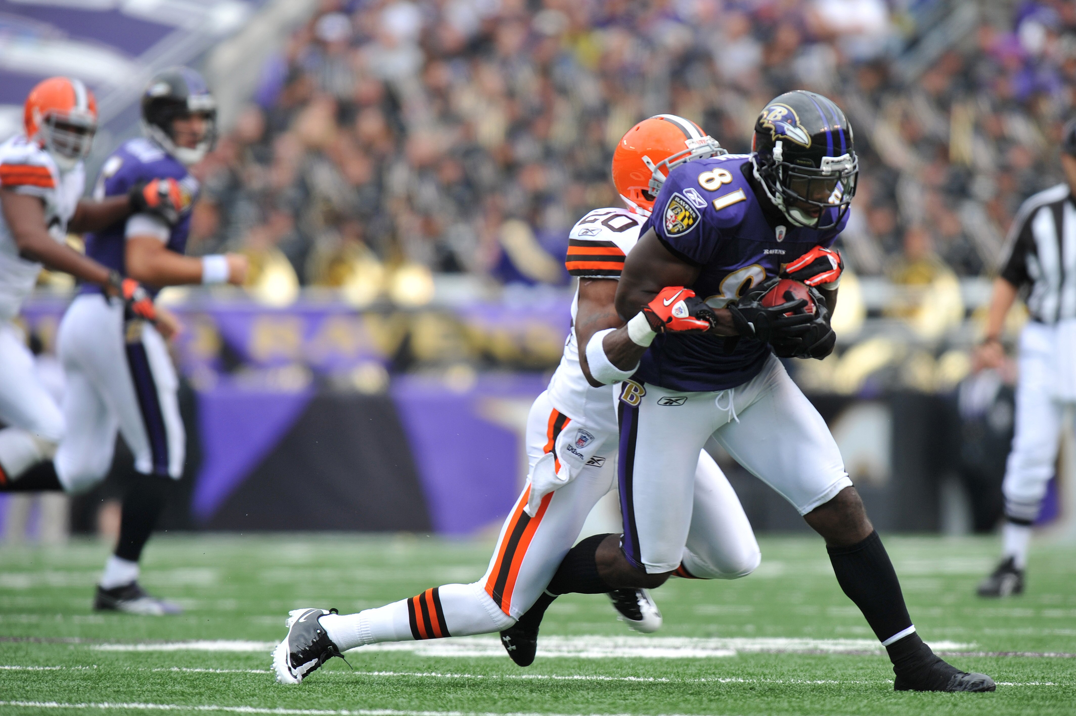 BALTIMORE - SEPTEMBER 26:  Anquan Boldin #81 of the Baltimore Ravens runs the ball against the Cleveland Browns  at M&T Bank Stadium on September 26, 2010 in Baltimore, Maryland. The Ravens lead the Browns at the half 14-10. (Photo by Larry French/Getty I