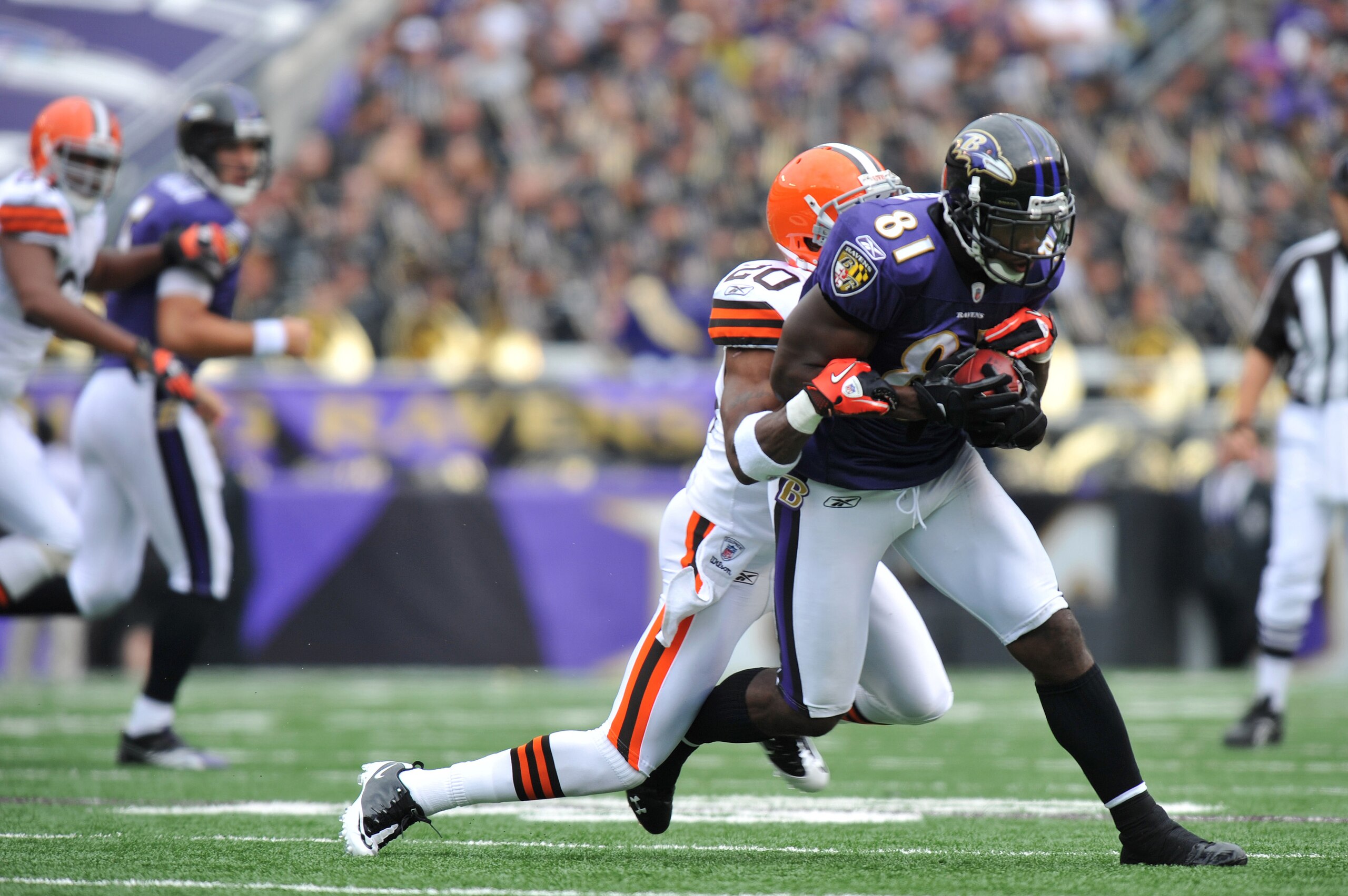 BALTIMORE - SEPTEMBER 26:  Anquan Boldin #81 of the Baltimore Ravens runs the ball against the Cleveland Browns  at M&T Bank Stadium on September 26, 2010 in Baltimore, Maryland. The Ravens lead the Browns at the half 14-10. (Photo by Larry French/Getty I
