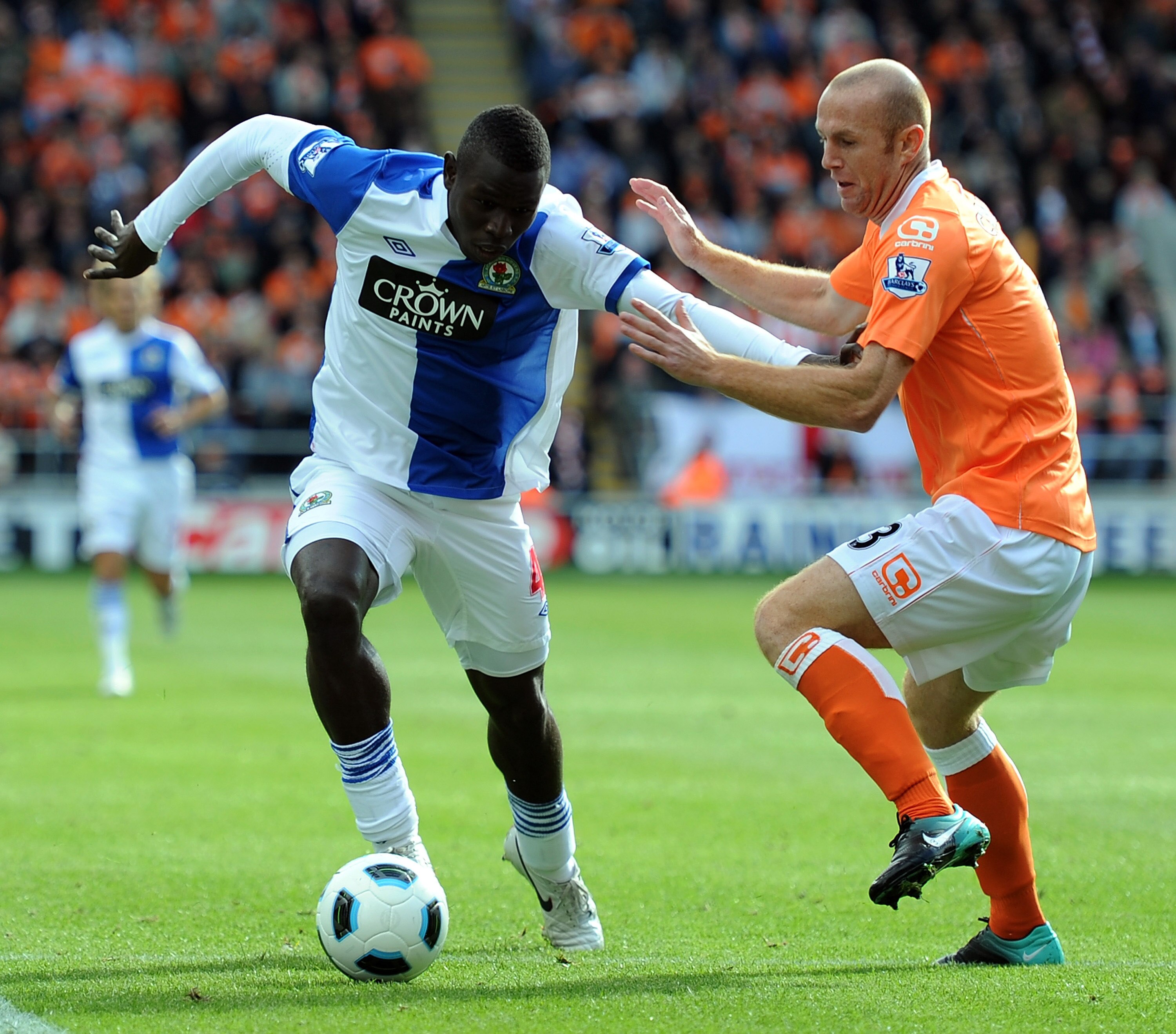 BLACKPOOL, ENGLAND - SEPTEMBER 25: Stephen Crainey of Blackpool (R) competes with Mame Biram Diouf of Blackburn Rovers during the Barclays Premiership match between Blackpool and Blackburn Rovers at Bloomfield Road on September 25, 2010 in Blackpool, Engl