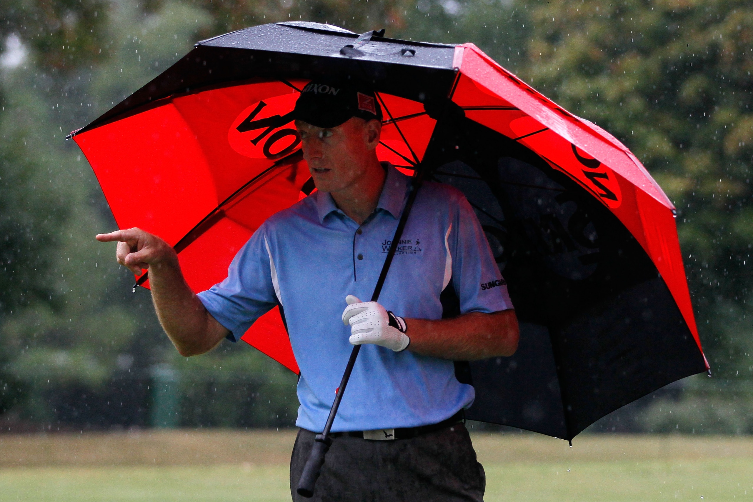 ATLANTA - SEPTEMBER 26:  Jim Furyk waits under an umbrella during the final round of THE TOUR Championship presented by Coca-Cola at East Lake Golf Club on September 26, 2010 in Atlanta, Georgia.  (Photo by Kevin C. Cox/Getty Images)
