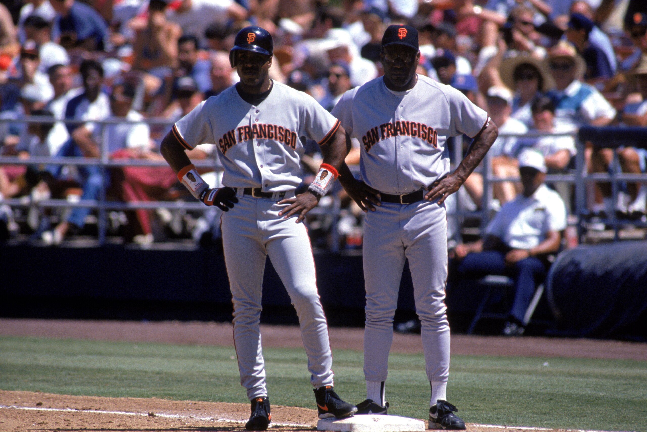 SAN FRANCISCO - AUGUST 3: (L-R) Barry Bonds #25 stands on first base next to his father and first base coach Bobby Bonds of the San Francisco Giants during a game against the San Diego Padres at Qualcomm Stadium on August 3, 1995 in San Diego, California SAN FRANCISCO - AUGUST 3: (L-R) Barry Bonds #25 stands on first base next to his father and first base coach Bobby Bonds of the San Francisco Giants during a game against the San Diego Padres at Qualcomm Stadium on August 3, 1995 in San Diego, California