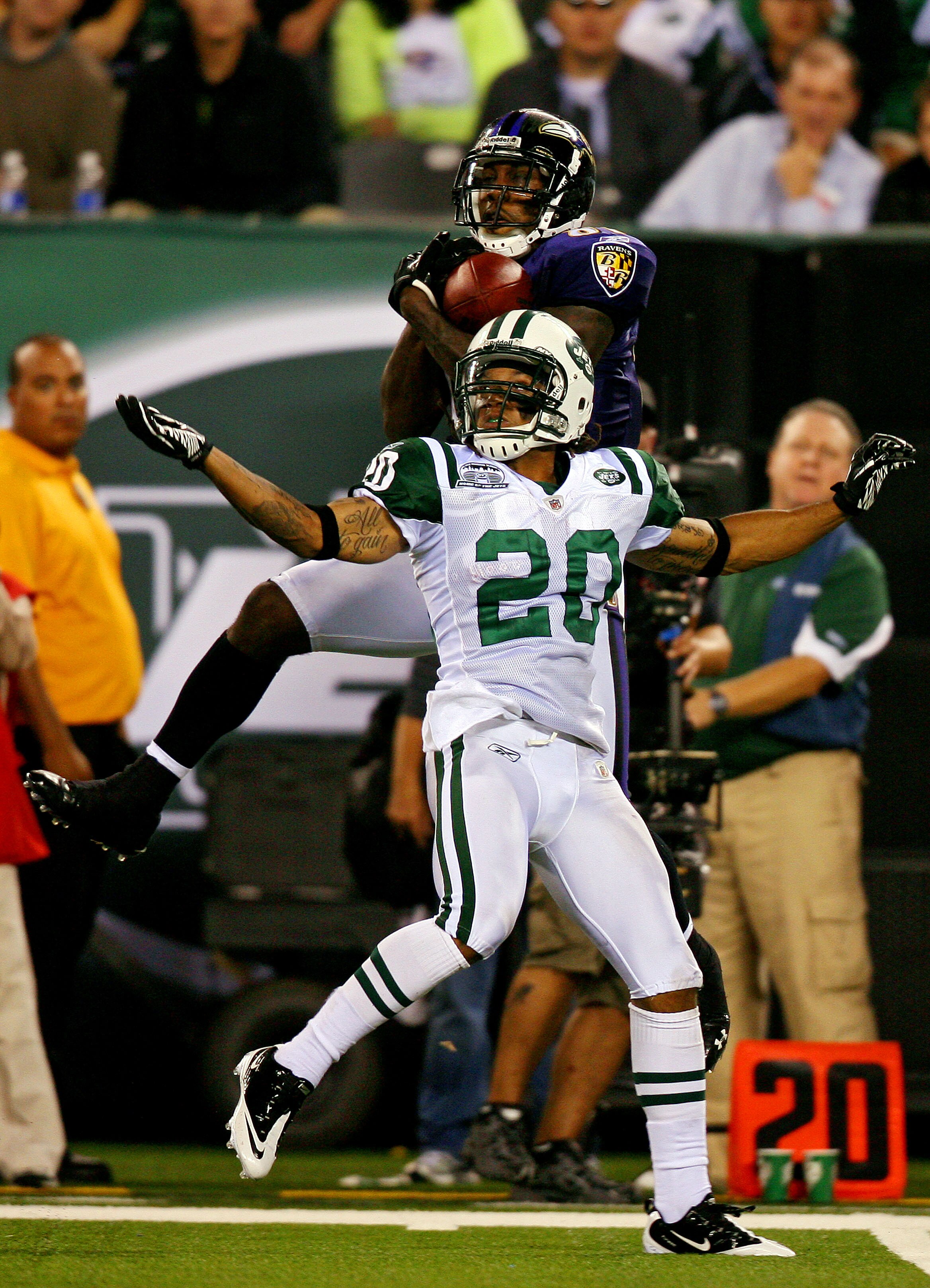 EAST RUTHERFORD, NJ - SEPTEMBER 13:  Anquan Boldin #81 of the Baltimore Ravens goes up for a pass against Kyle Wilson #20 of the New York Jets during the Jets home opener at the New Meadowlands Stadium on September 13, 2010 in East Rutherford, New Jersey.