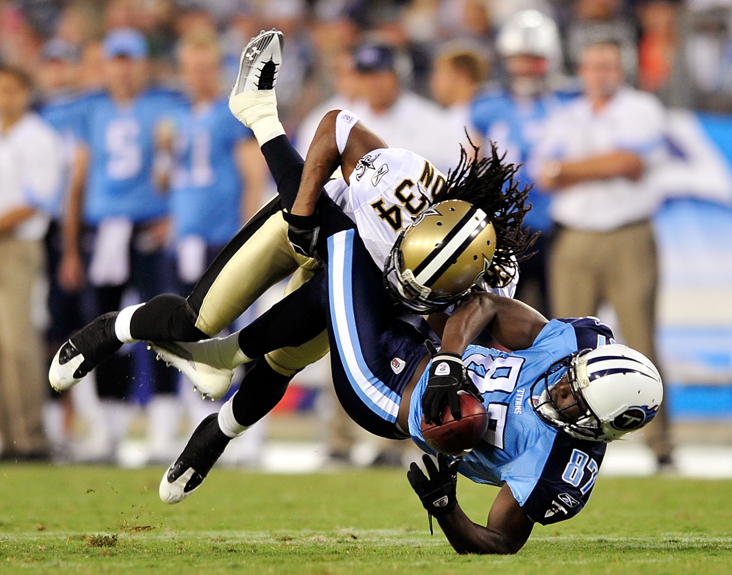 NASHVILLE, TN - SEPTEMBER 02:  Patrick Robinson #34 of the New Orleans Saints makes the hit on Lavelle Hawkins #87 of the Tennessee Titans after a 5-yard gain during the first half of an exhibition game at LP Field on September 2, 2010 in Nashville, Tenne