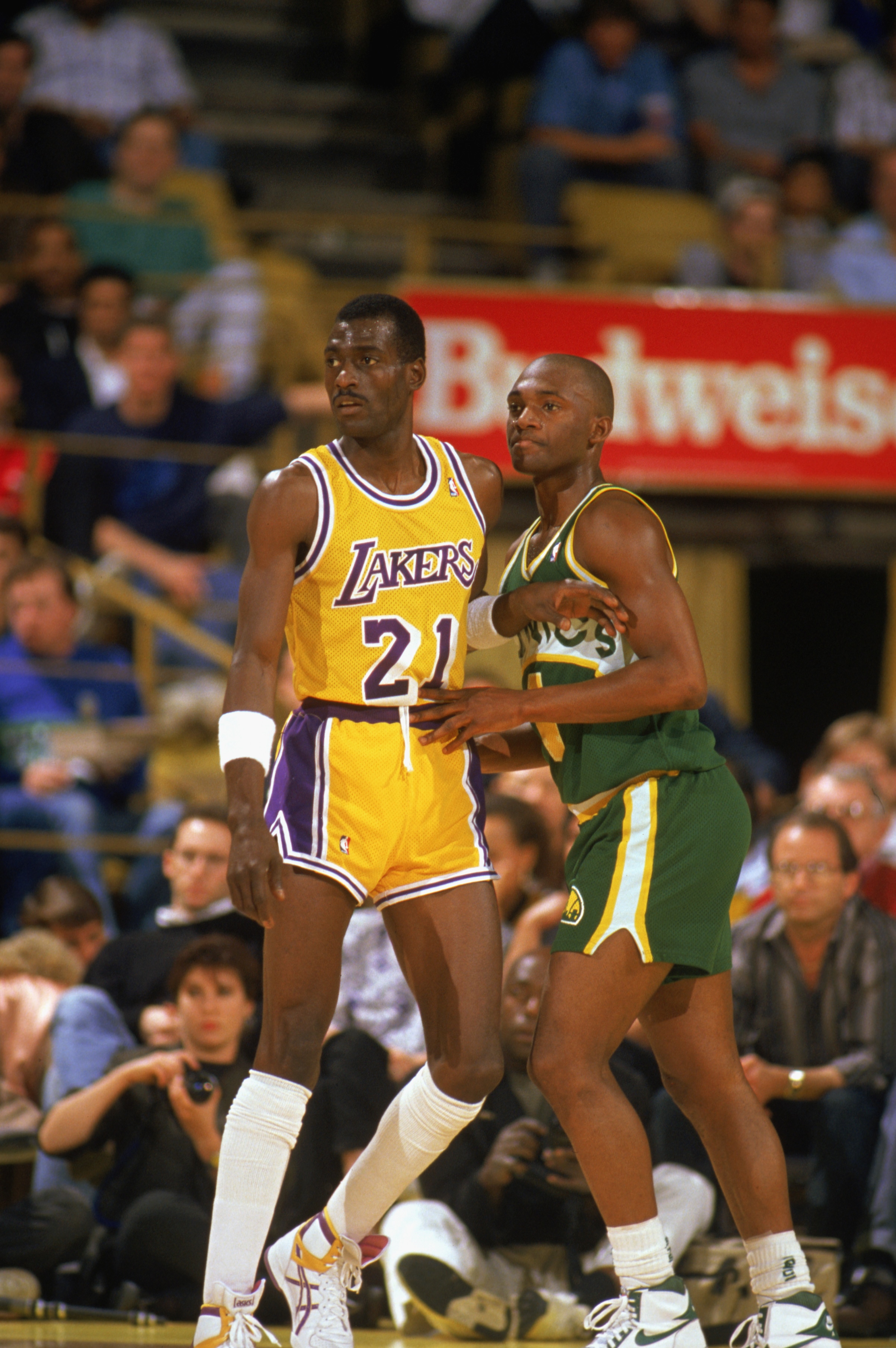 LOS ANGELES - 1990:  Sedale Threatt #4 of the Seattle Supersonics and Michael Cooper #21 of the Los Angeles Lakers battle for position during a game in the 1989-1990 NBA season at the Great Western Forum in Los Angeles, California.  (Photo by Ken Levine/G